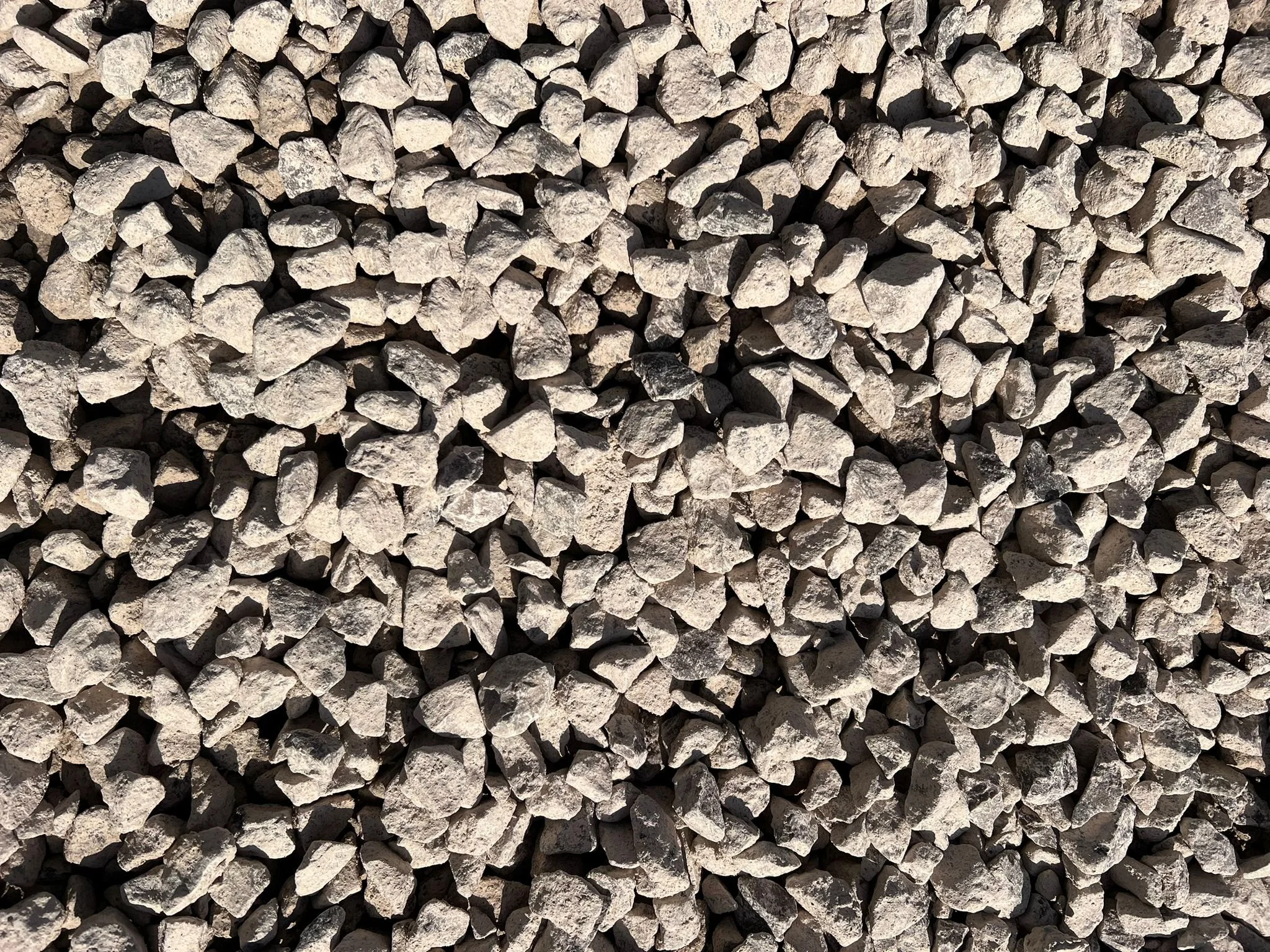 Close-up view of a large pile of small gray rocks or gravel.