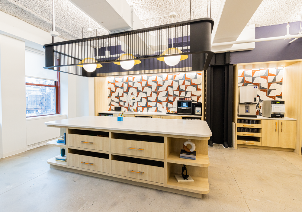 LinkedIn’s employee pantry includes standing room around a kitchen island, and freestanding meeting furniture configured for both collaboration and privacy. 