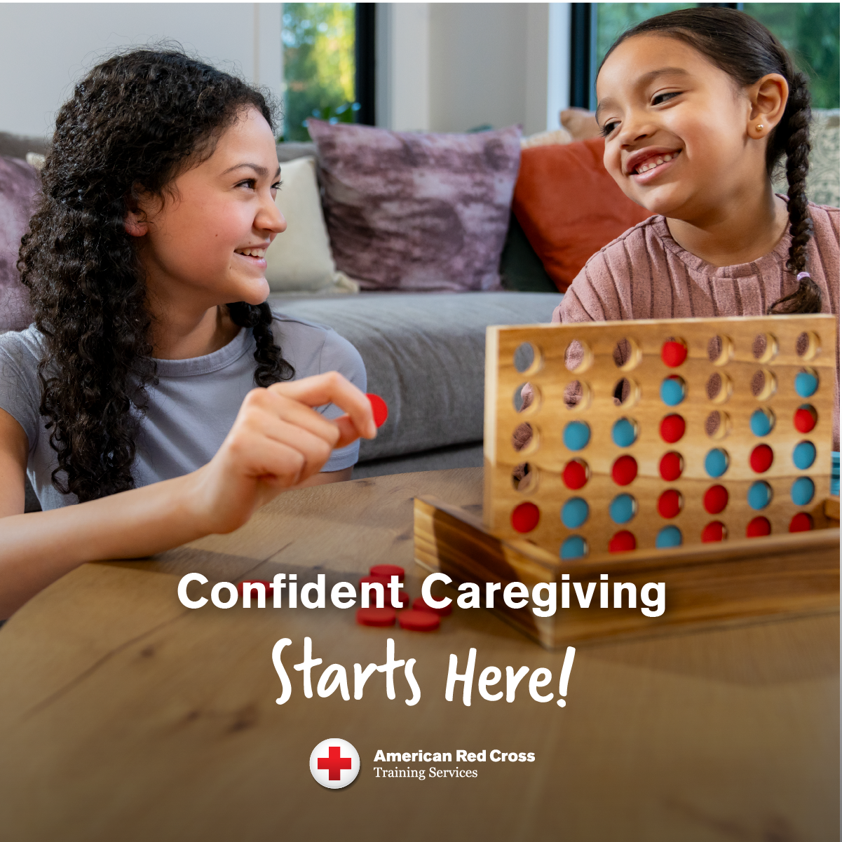 A teen girl plays a board game with a little girl she is babysitting. The caption states, "Confident Caregiving starts here!". American Red Cross Training Services empower young people to gain the skills to keep kids safe.