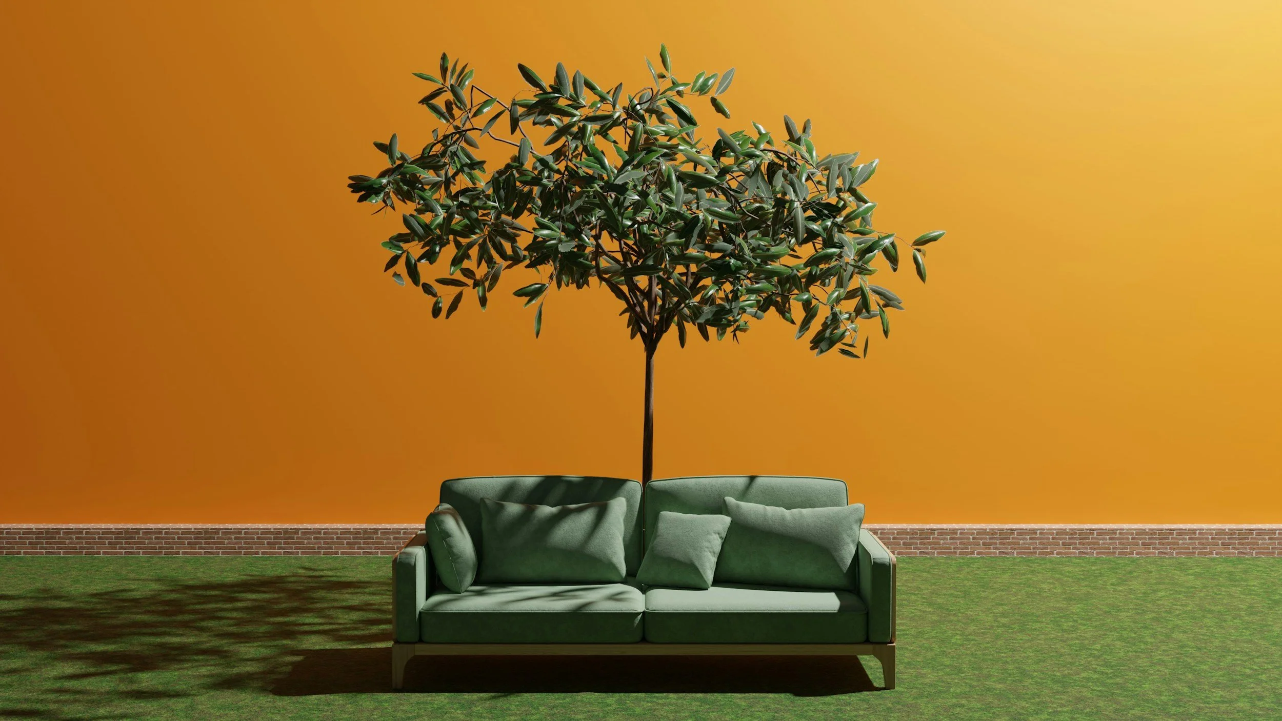 A backyard scene with a green sofa and an artificial tree against an orange wall with a brick base.