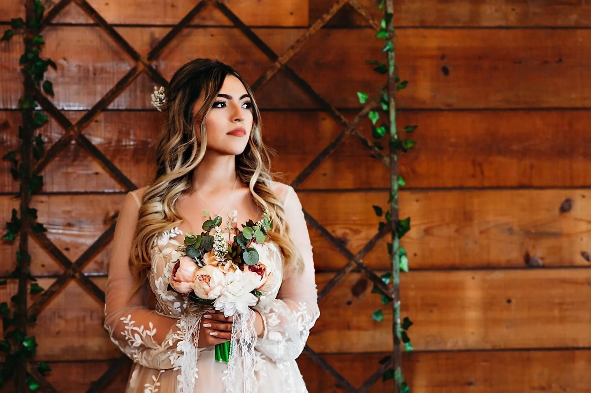 bride in lace dress with bouquet