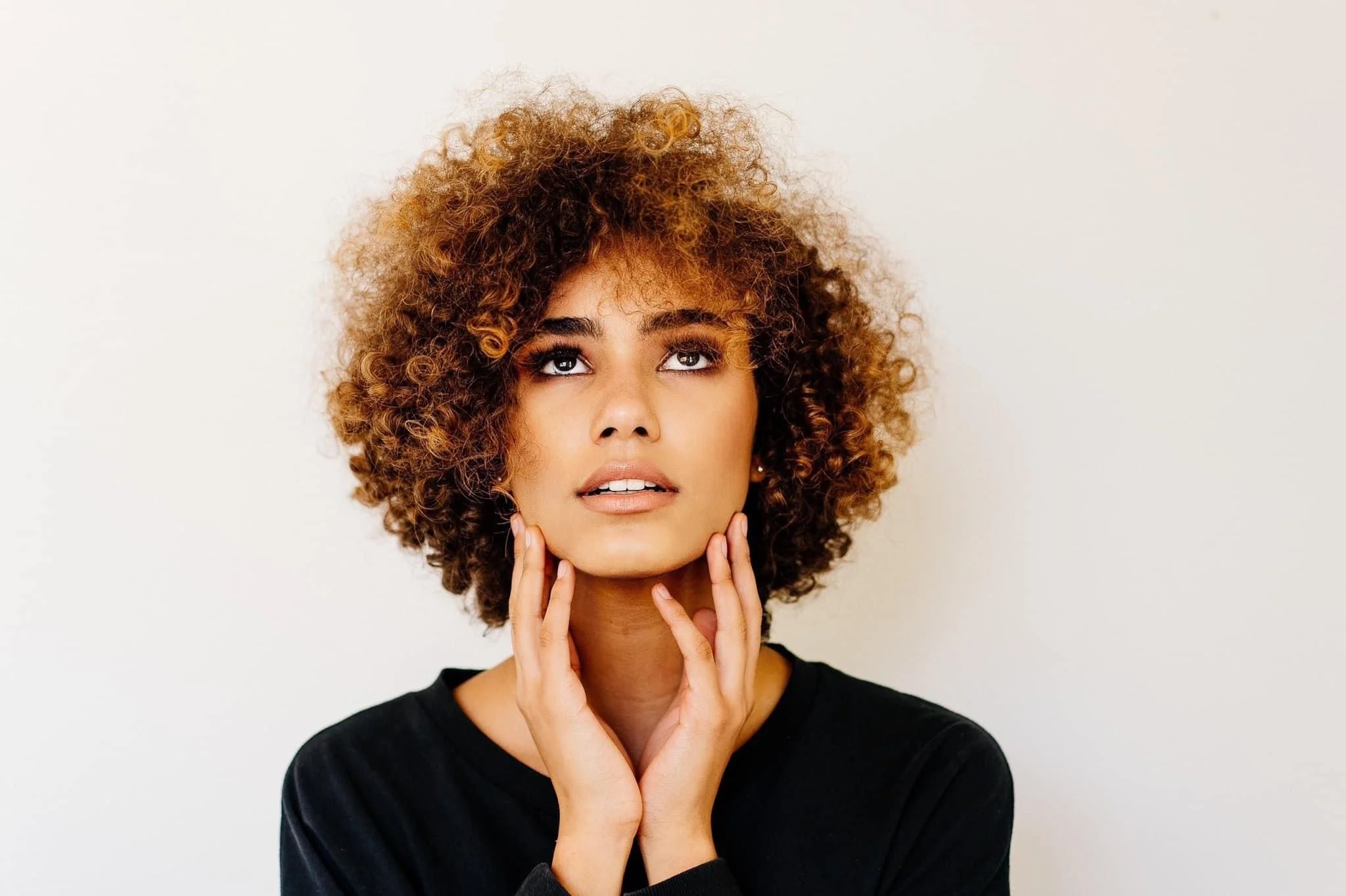brand headshot looking up