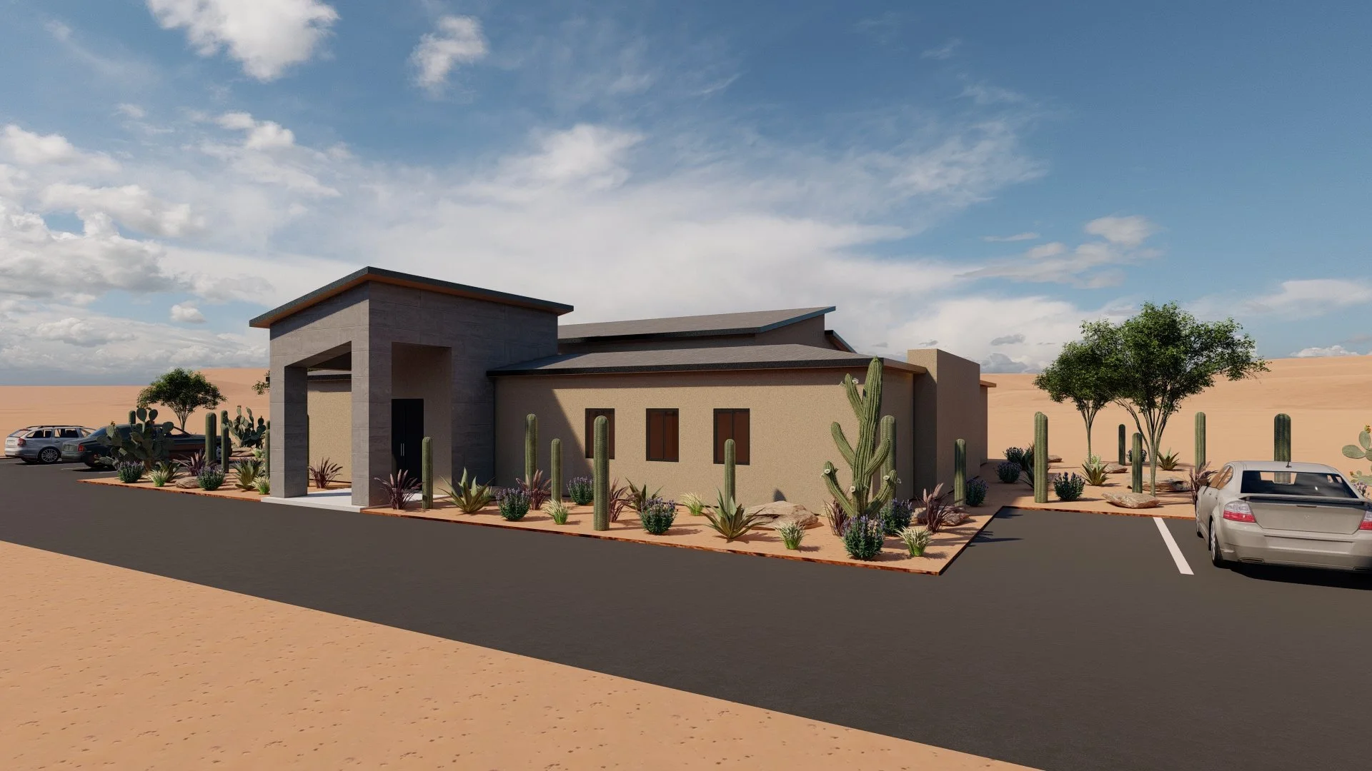 A modern desert-style house with flat roofs, surrounded by desert landscaping with cacti and sparse trees, parked cars, and a paved driveway, under a partly cloudy sky.