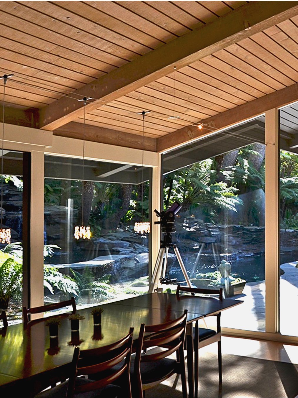 Mid century modern dining alcove remodel, with new lighting and glass doors to pool .jpg