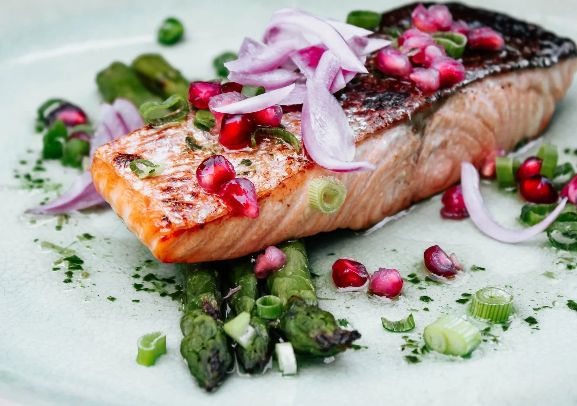 Grilled salmon fillet topped with sliced vegeables