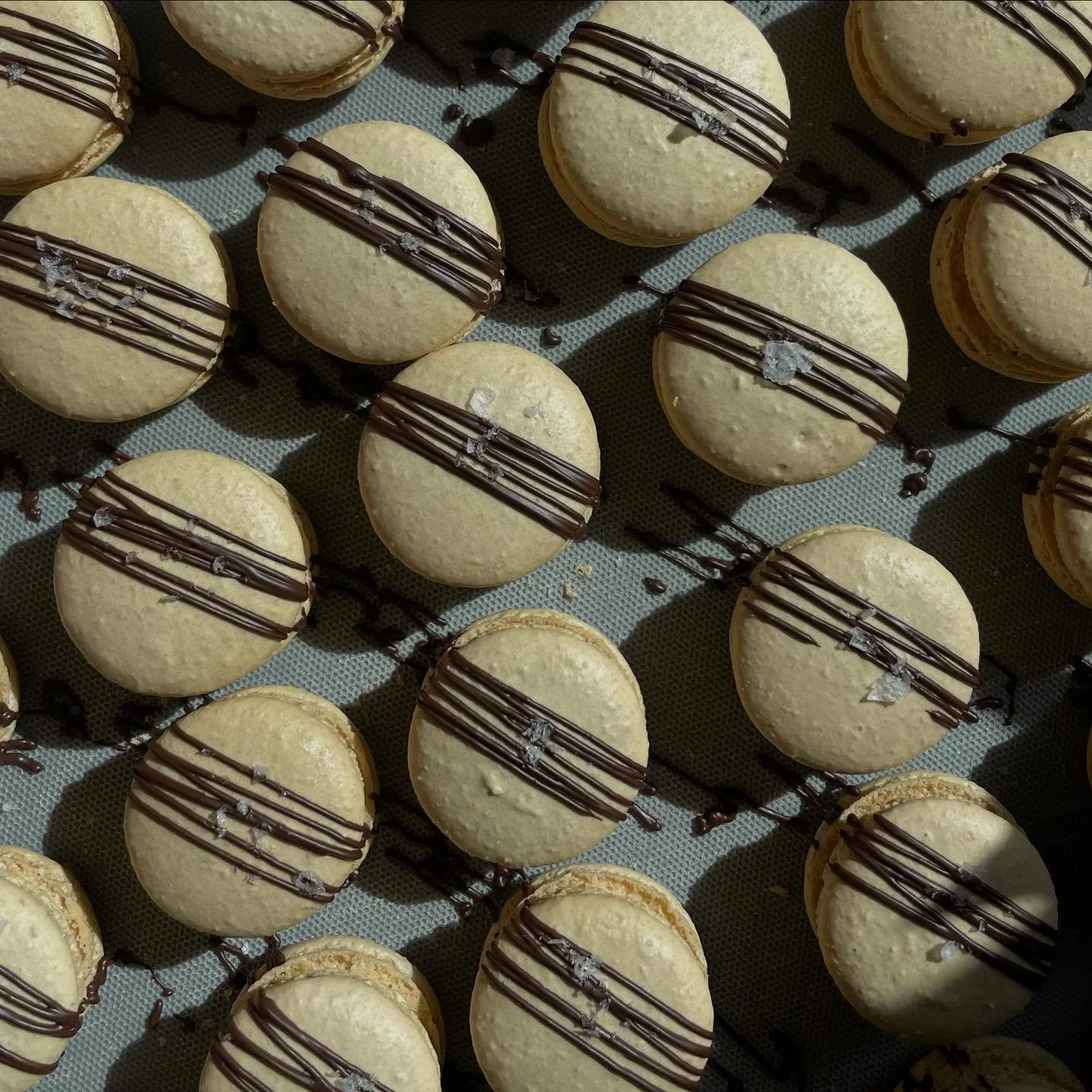 Salted Caramel Macs- A delicate almond shell filled with silky house-made buttercream and a drizzle of golden caramel, kissed with sea salt for the perfect balance of sweet and savory. 

#saltedcaramel #saltmakeseverythingbetter #macaron
