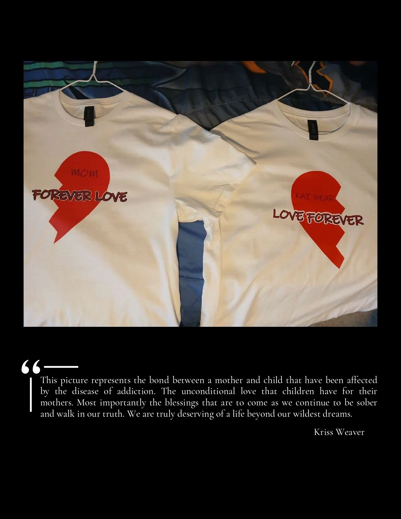 Two white T-shirts with red broken heart graphics and sentimental messages for a mother and child, laid on a bed with a dark blanket.