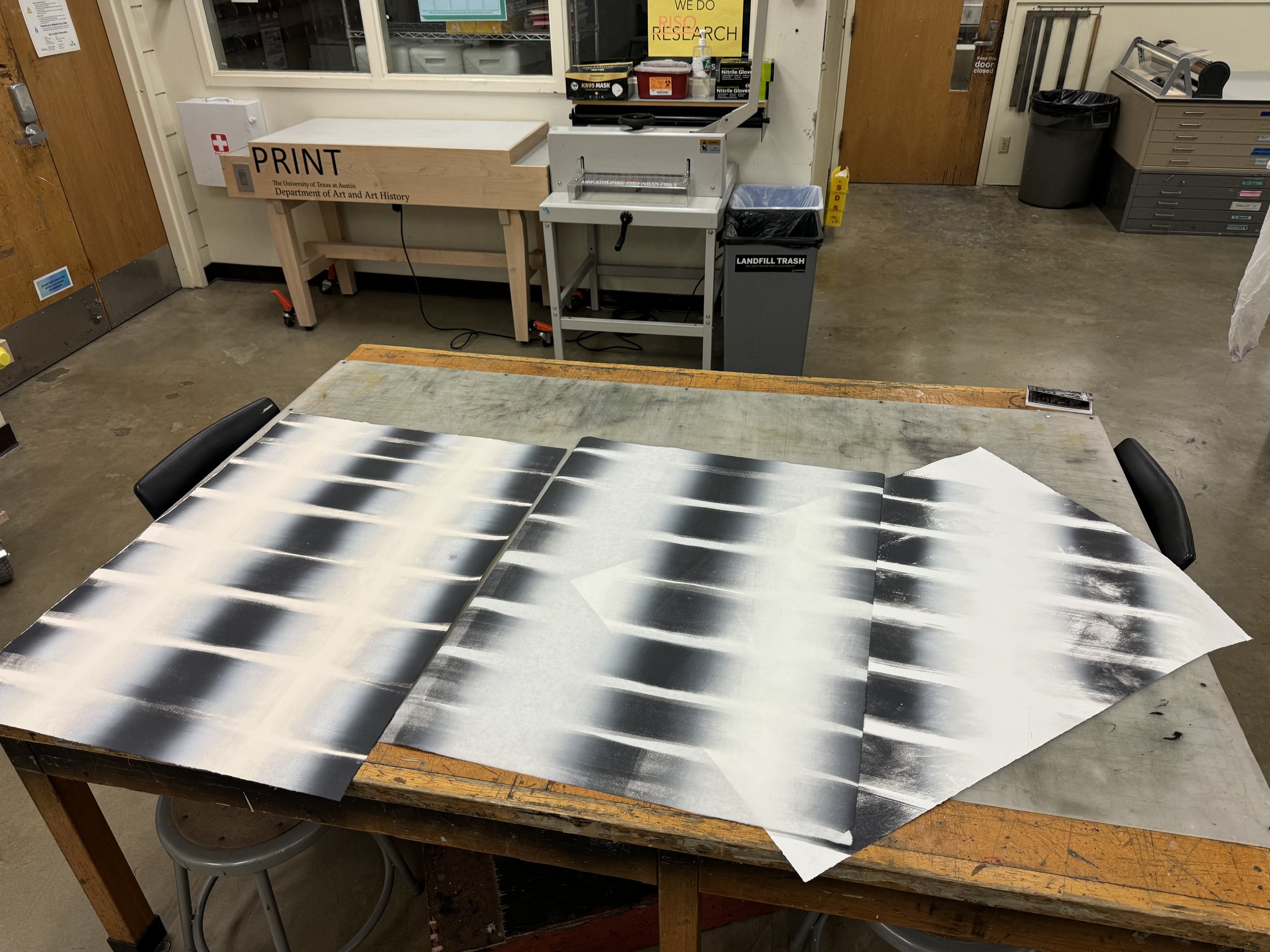 Process image: lining up brayer marks across a sheet with a tilted angle. 