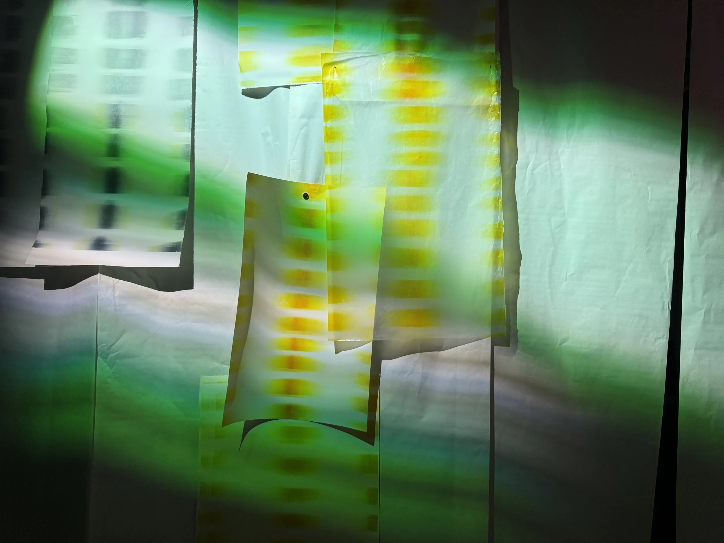 Flicker prints displayed under colored stage lights