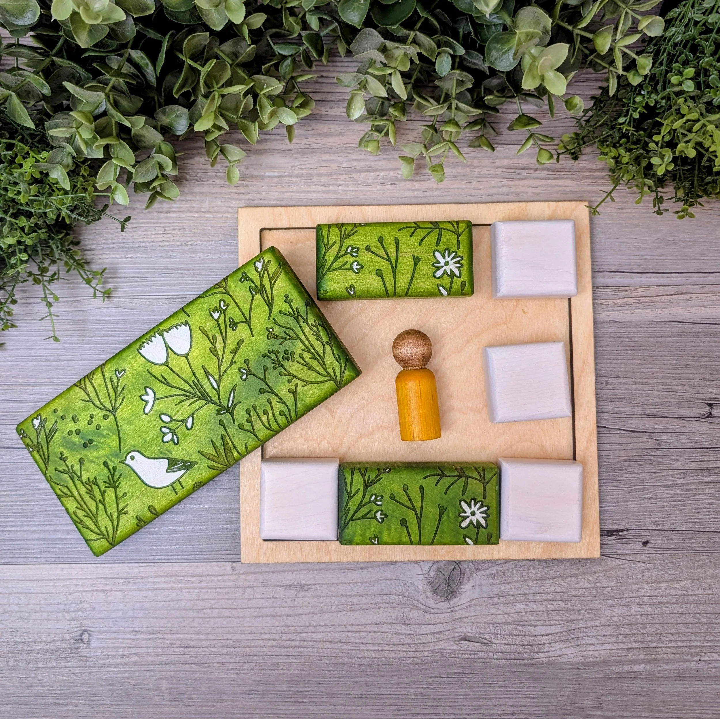 Handmade geometric wooden puzzle with larger patterned blocks