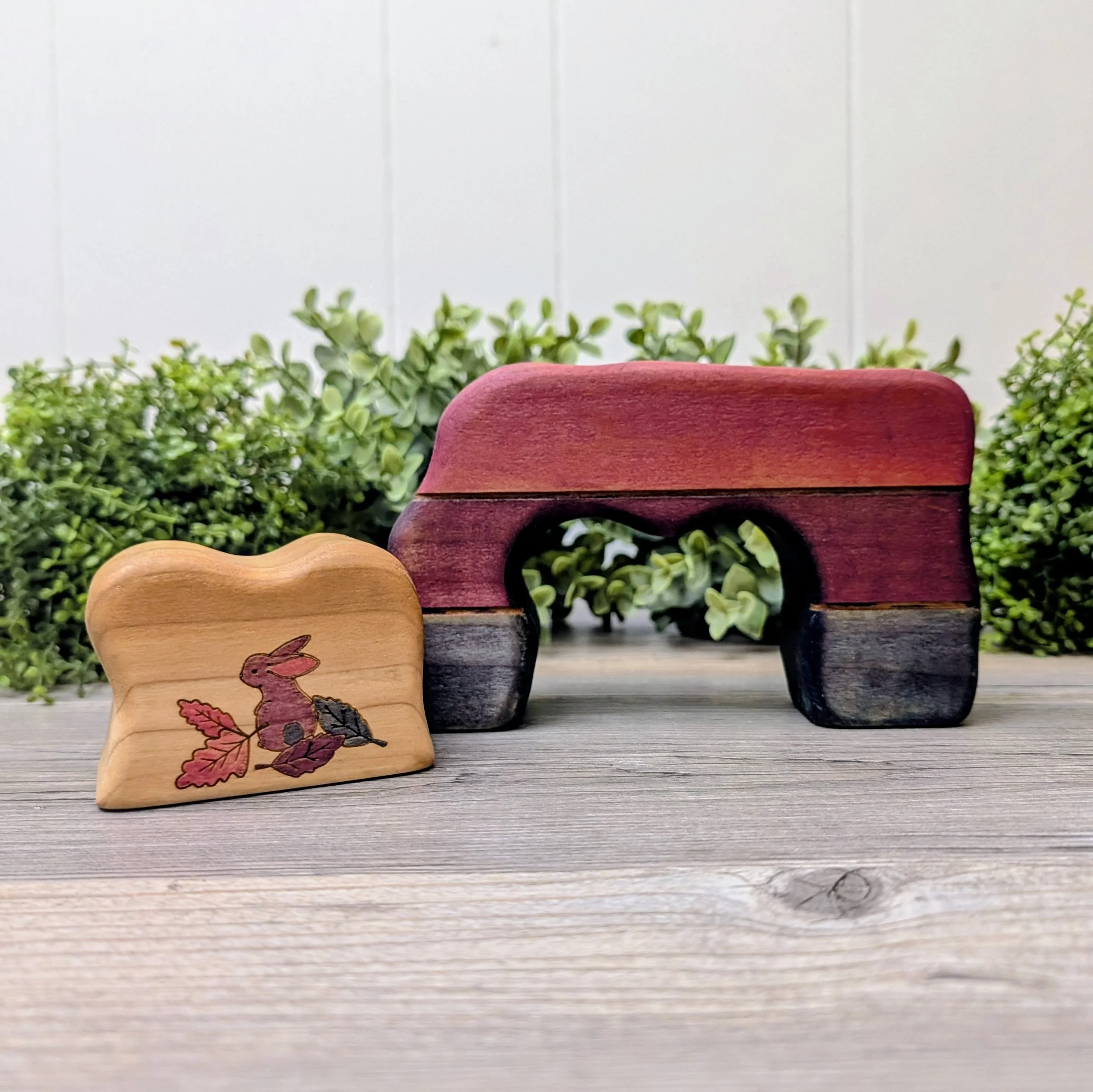 Wooden bunny cave interior featuring hand painted bunny with leaves