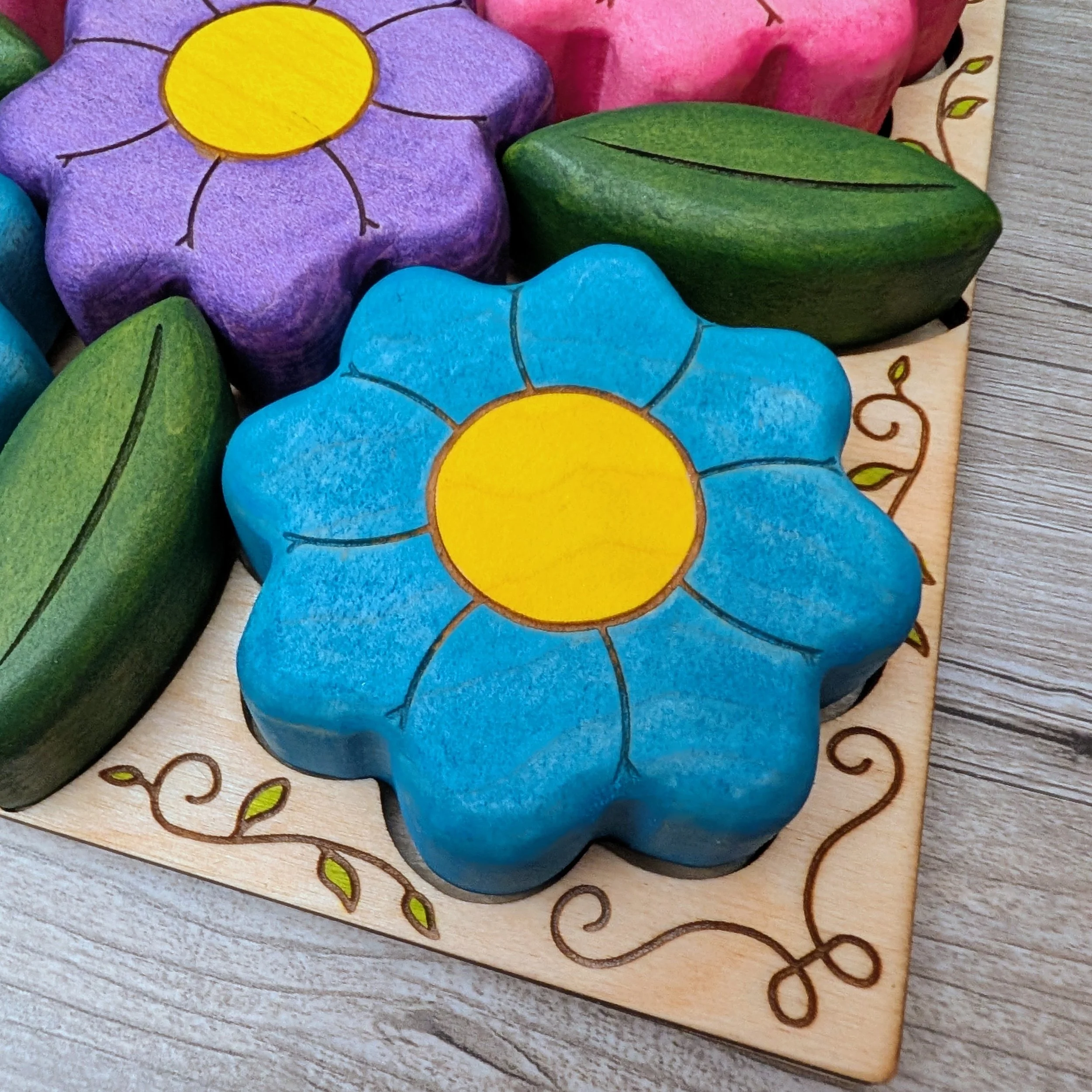 Wooden puzzle frame with hand drawn vine detail and painted leaves