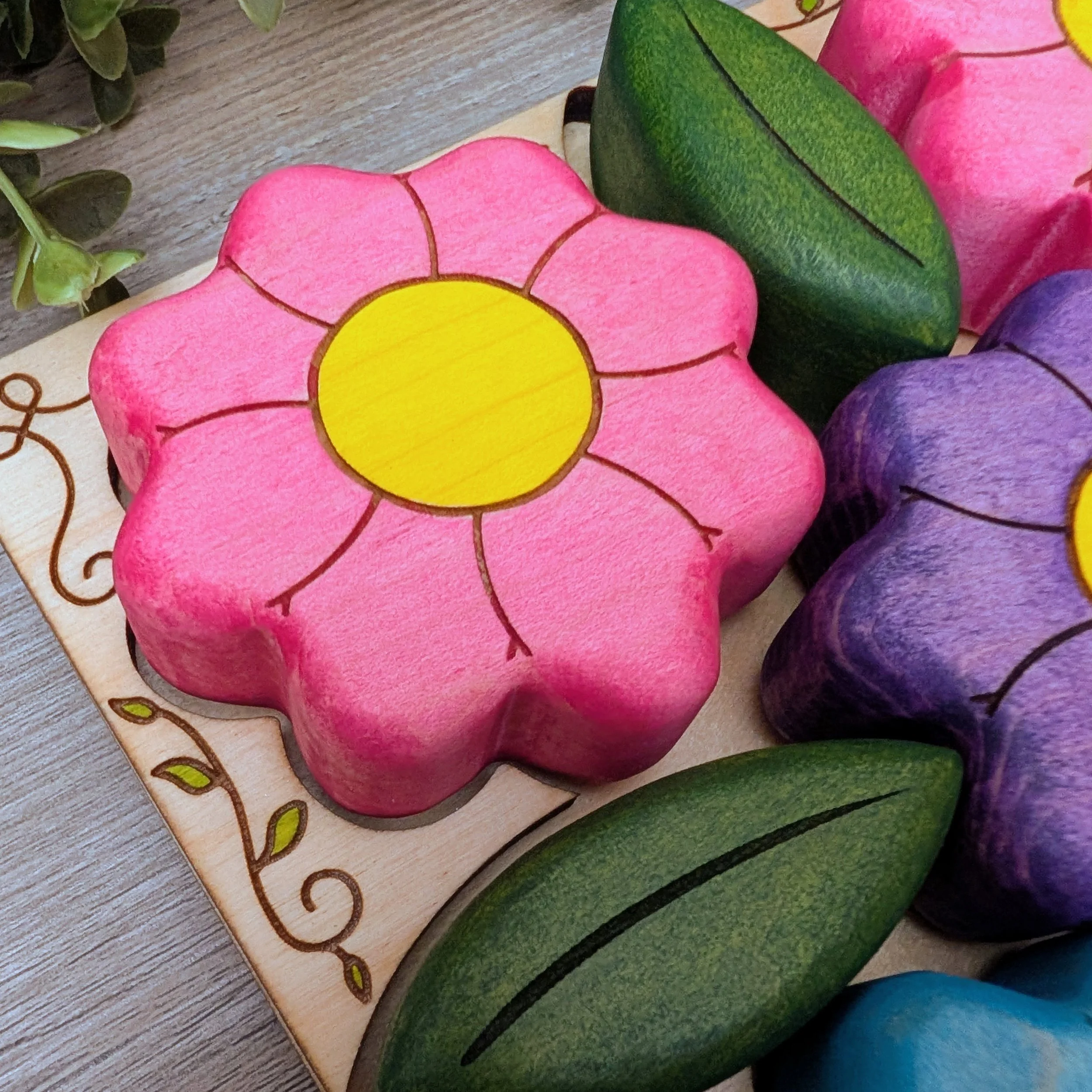 Wooden puzzle frame with hand drawn vine detail and painted leaves