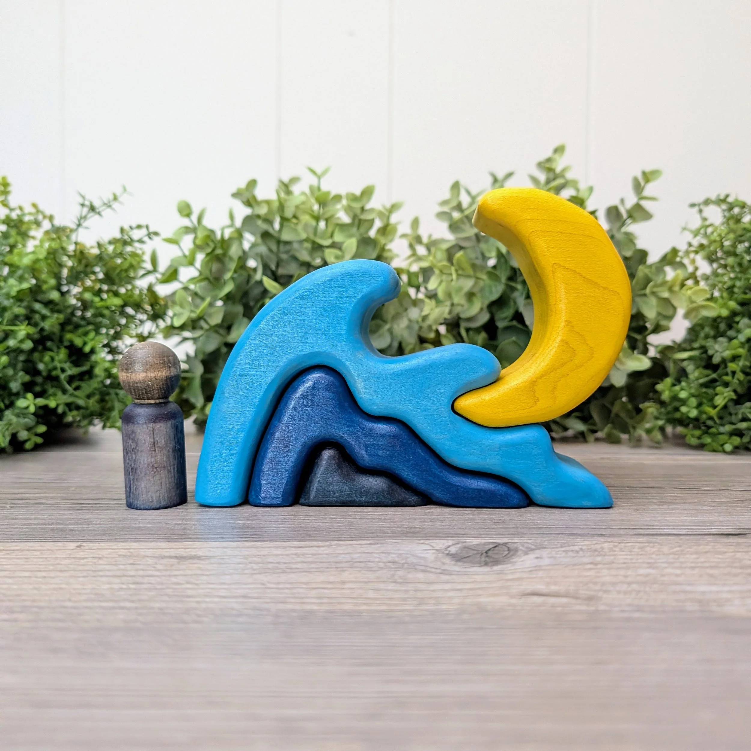 Wooden wave stacker with yellow moon and three blue nesting waves