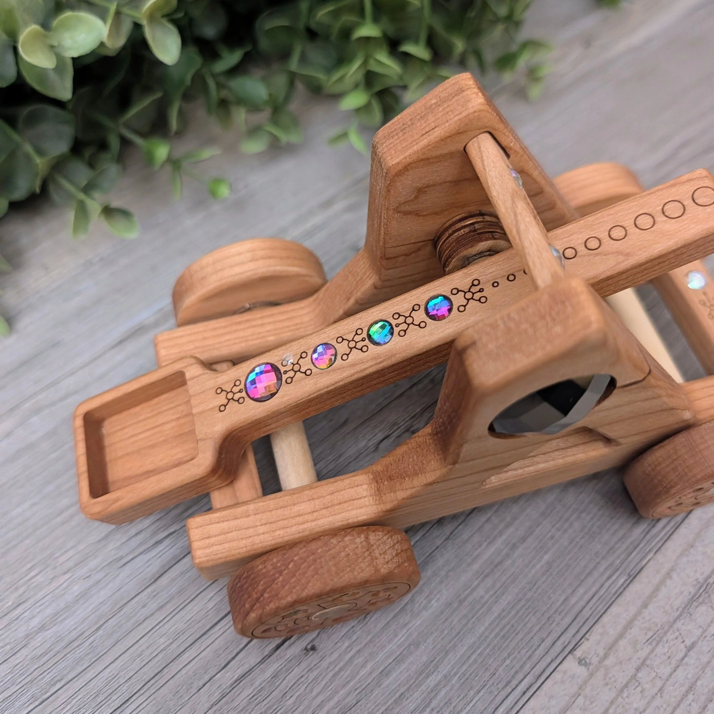 Wooden fantasy catapult for small world play with rainbow gem accents