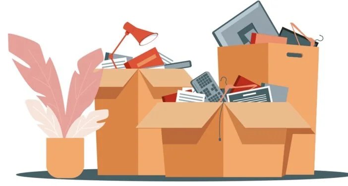 Several open cardboard boxes filled with assorted office supplies, electronics, and papers, with a potted plant nearby.