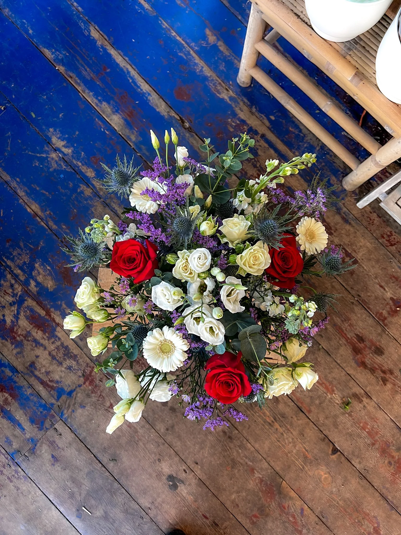 Wild seasonal flowers with red roses for valentines