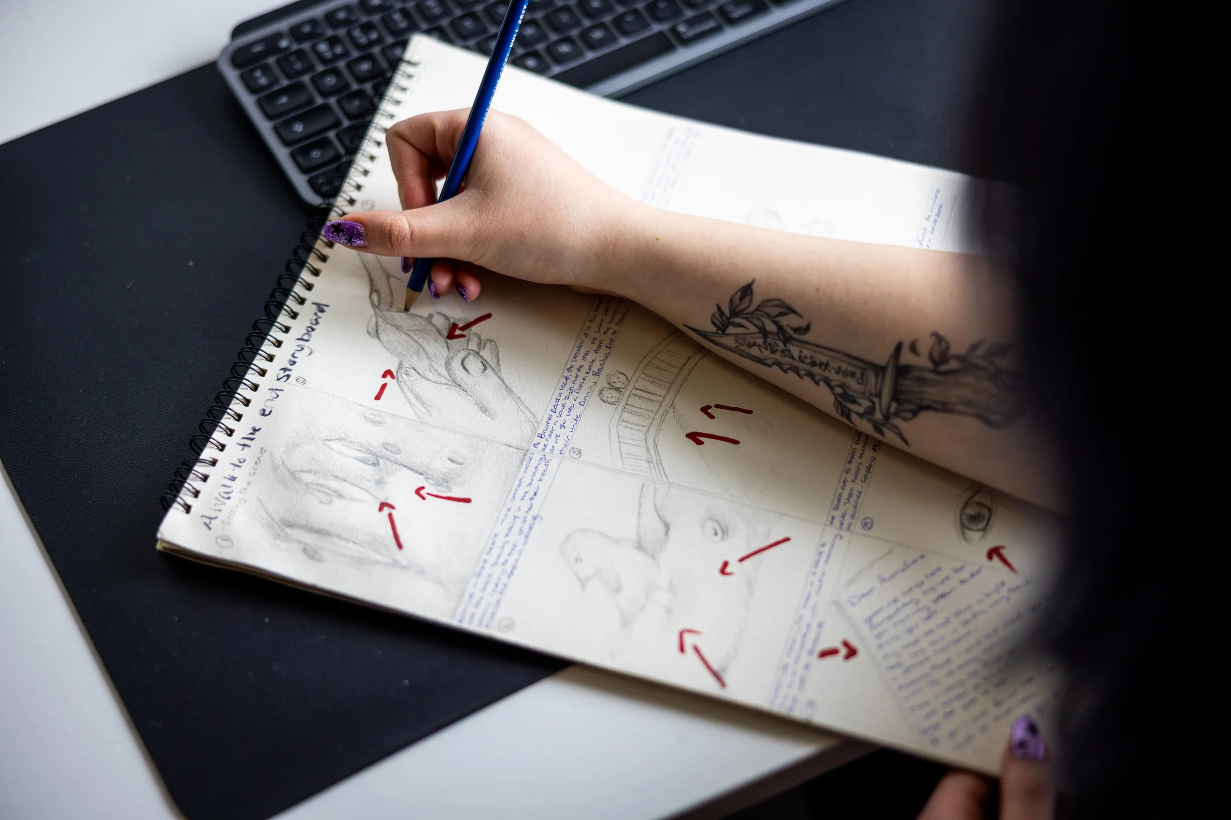 A woman drawing a storyboard for a video.