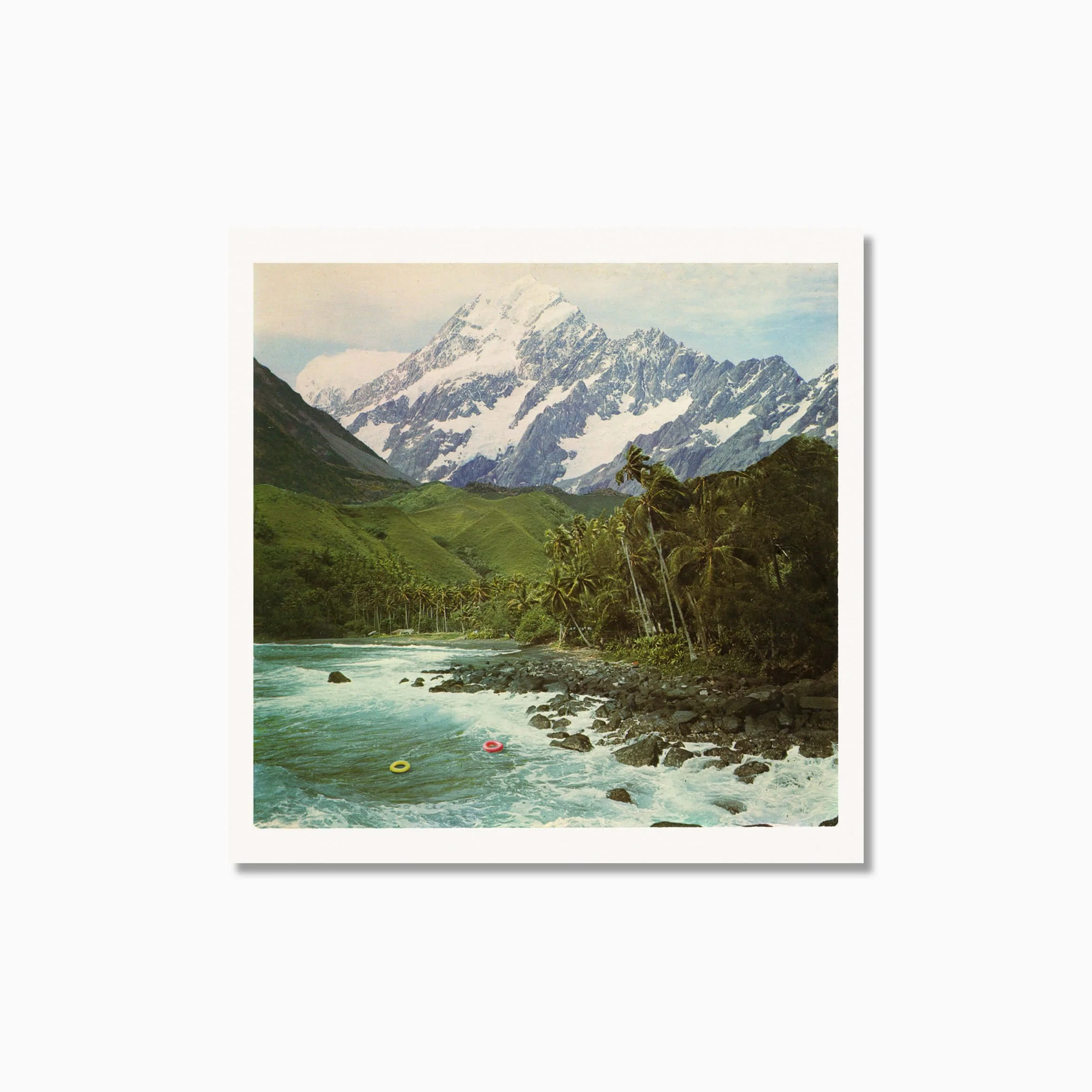 Unframed surreal vintage collage by Luca Marziale: Tropical beach meets snowy mountain; two floating rings on turquoise water, lush palms, and peaks.