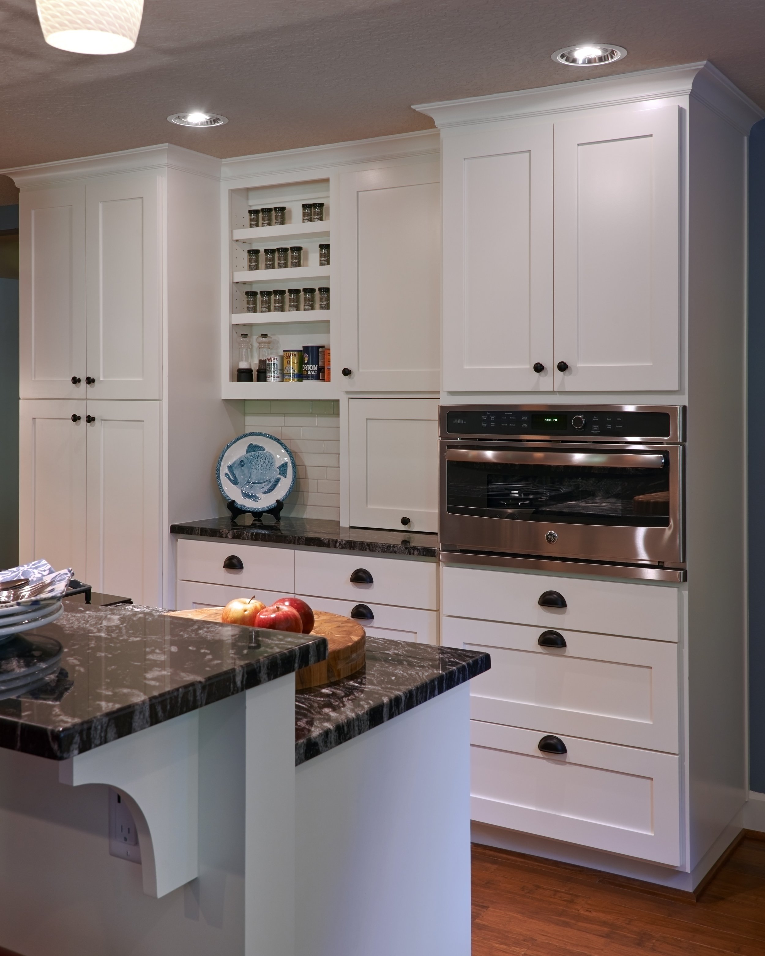 white cabinets and dark counter tops in portland oregon home kitchen design.jpg