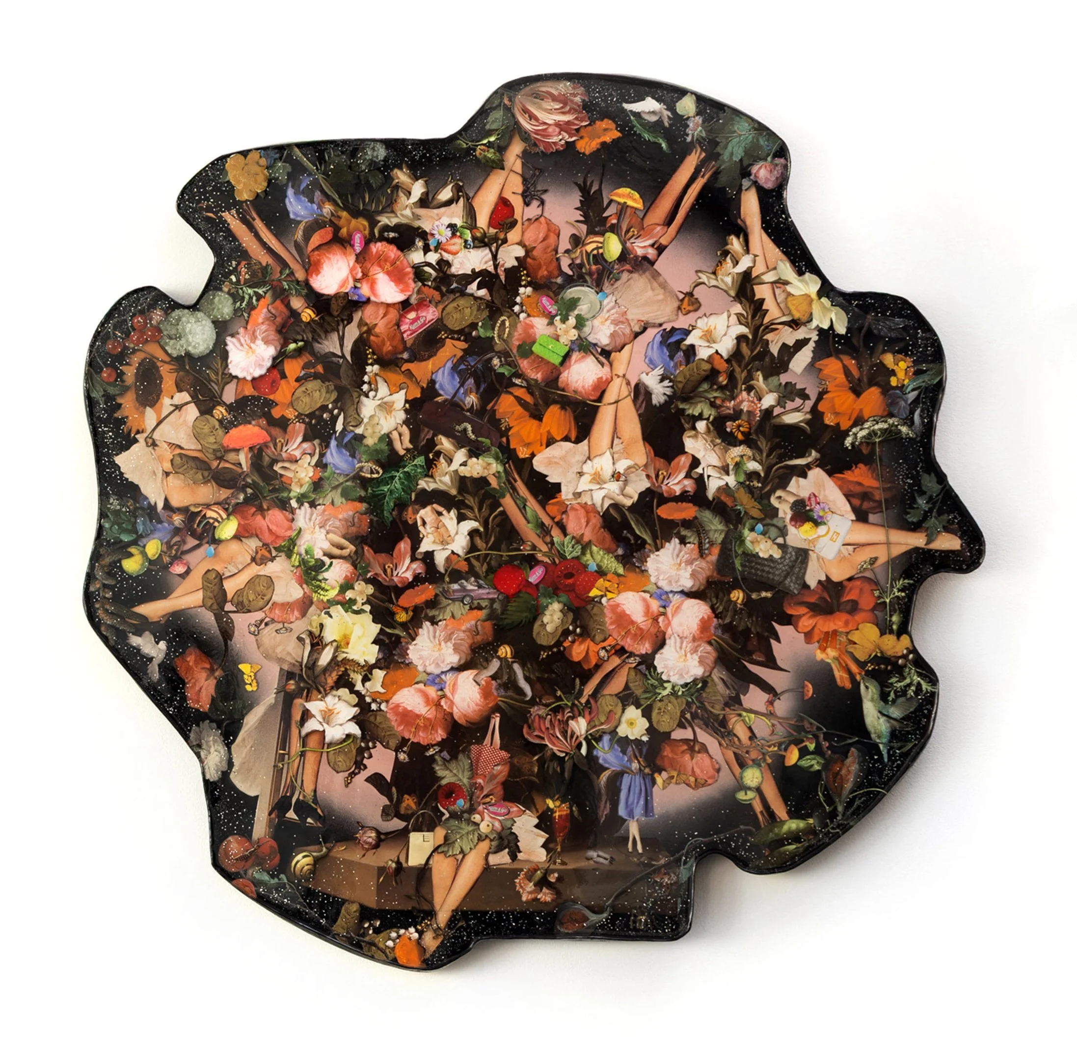 A decorative tray shaped like a bear, featuring a floral design with various colorful flowers and some small objects on it.