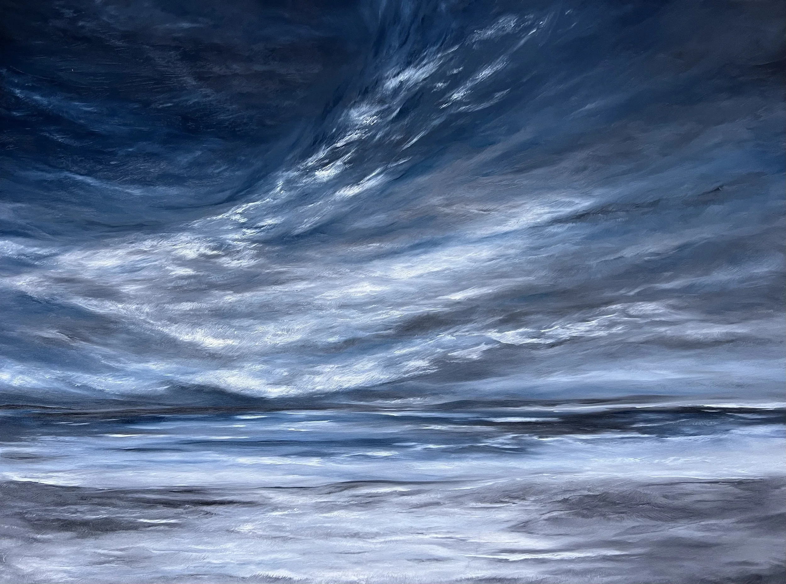 Waves in the ocean with white foam on the water's surface.
