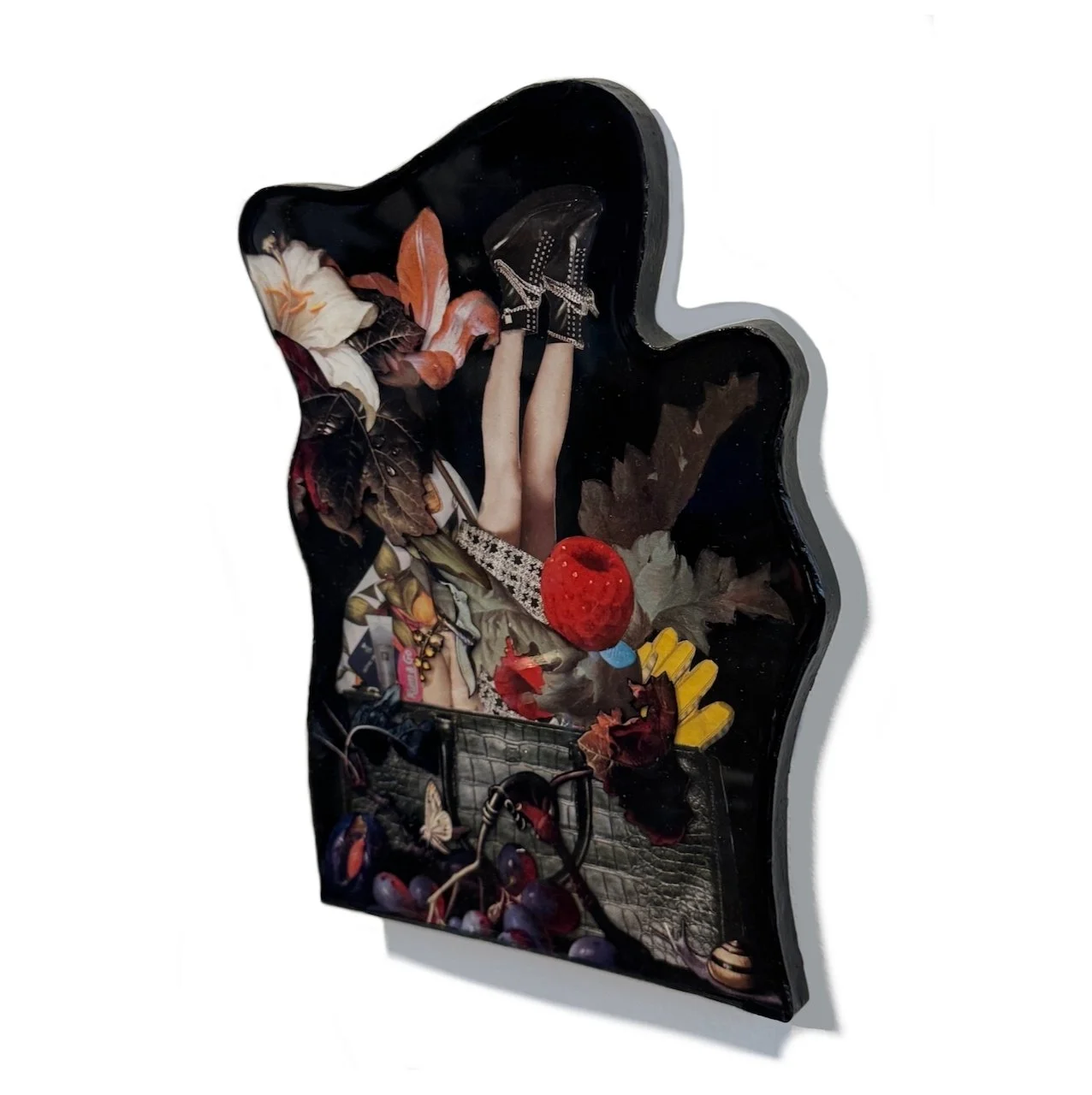 Mixed-media artwork featuring a pair of legs wearing lace-up shoes, surrounded by leaves, flowers, a red textured object, grapes, and other abstract elements on a black background.