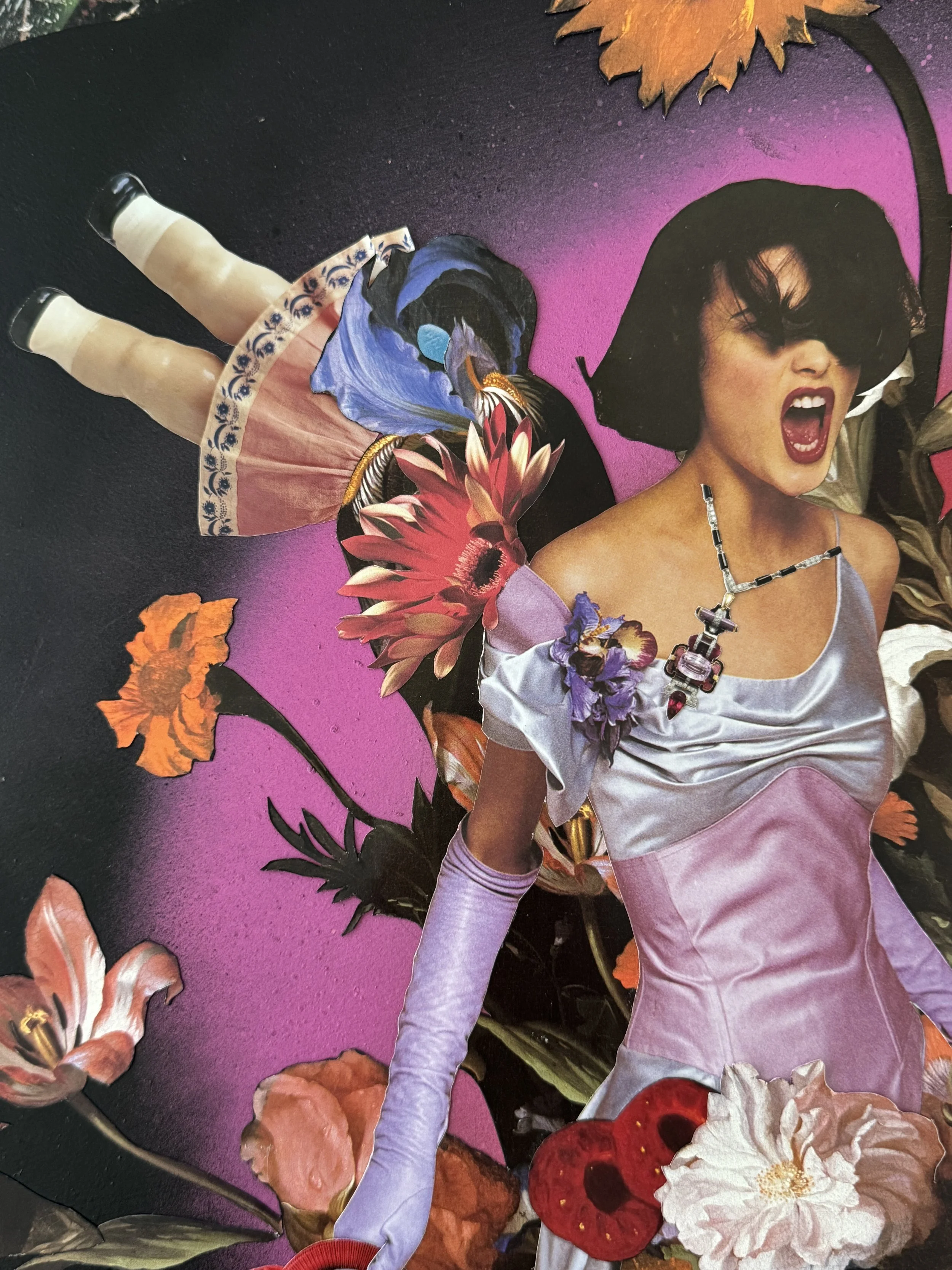 A collage featuring a woman with dark hair and bold makeup, surrounded by colorful flowers and butterflies on a pink and black background.