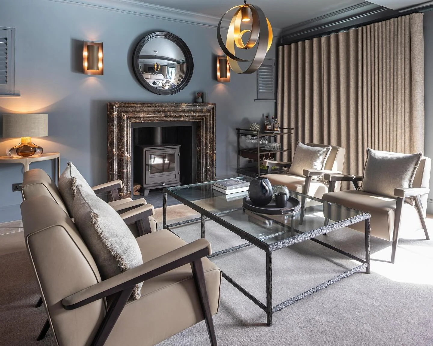 Nothing beats a cozy room in October 🍂
This space is all about comfort, with a dedicated conversation area and an upholstered TV wall that adds a touch of warmth and features a hidden door for a seamless, clean look. Perfect for those lazy movie nig