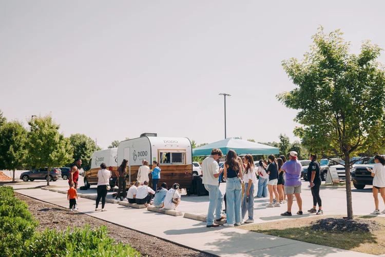 Dodo Coffee customers gathered around their Aero Build trailer