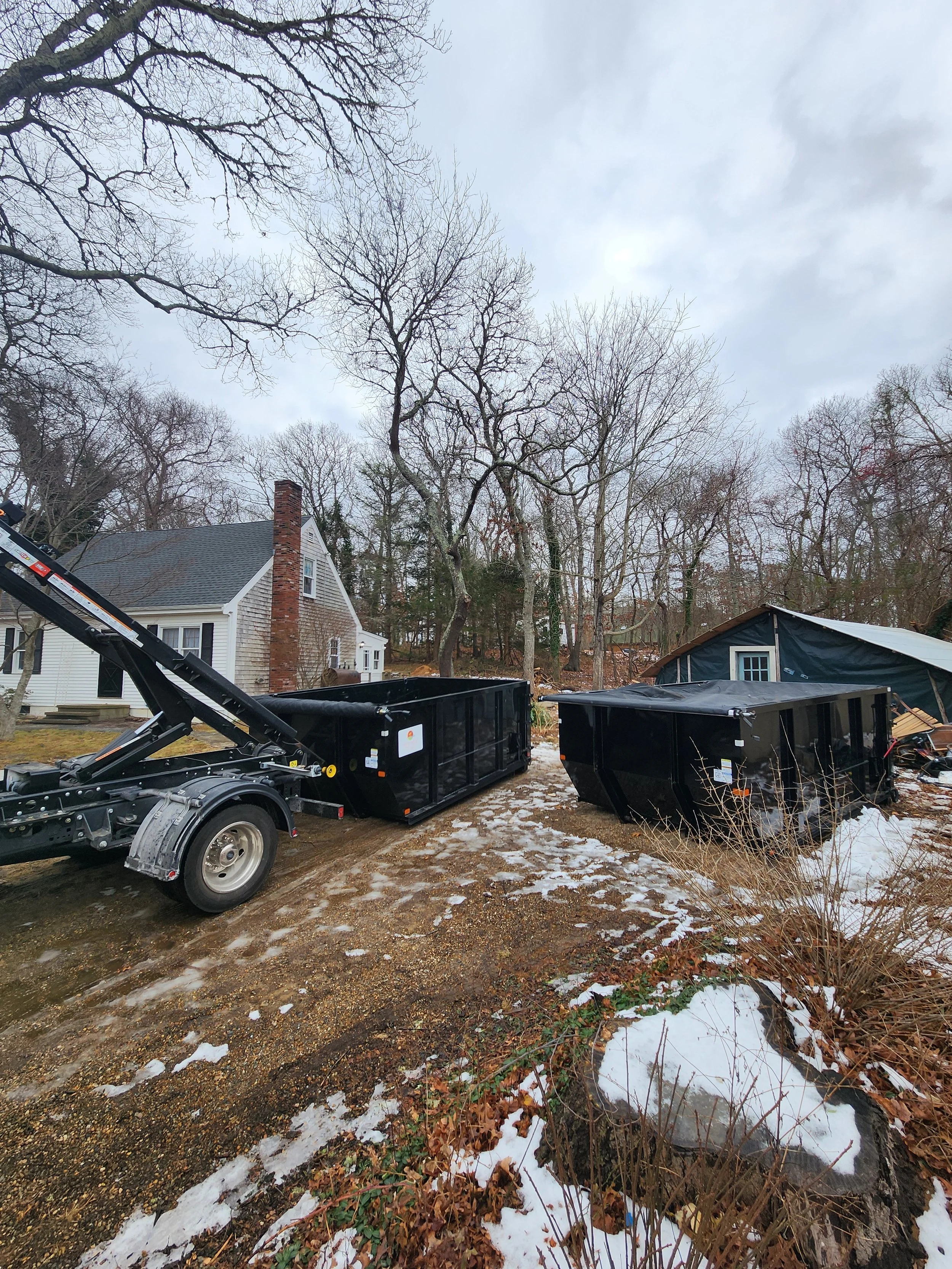 Multiple dumpster rental delivery for a single job site by West Wind MV on Martha’s Vineyard.