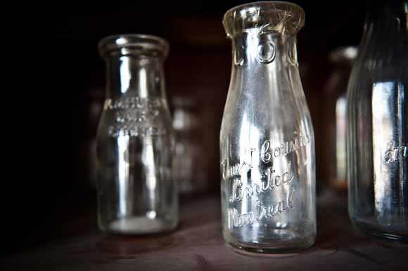 Close-up of old glass bottles used for milk delivery