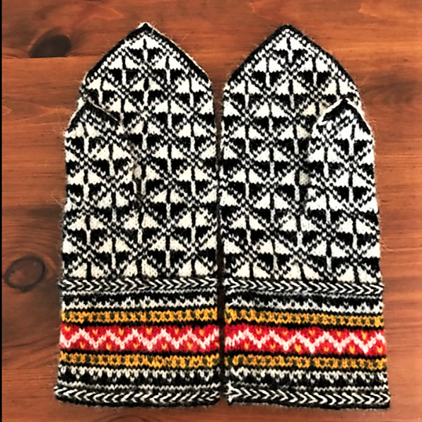 Black, white, and red Latvian mittens with geometric pattern