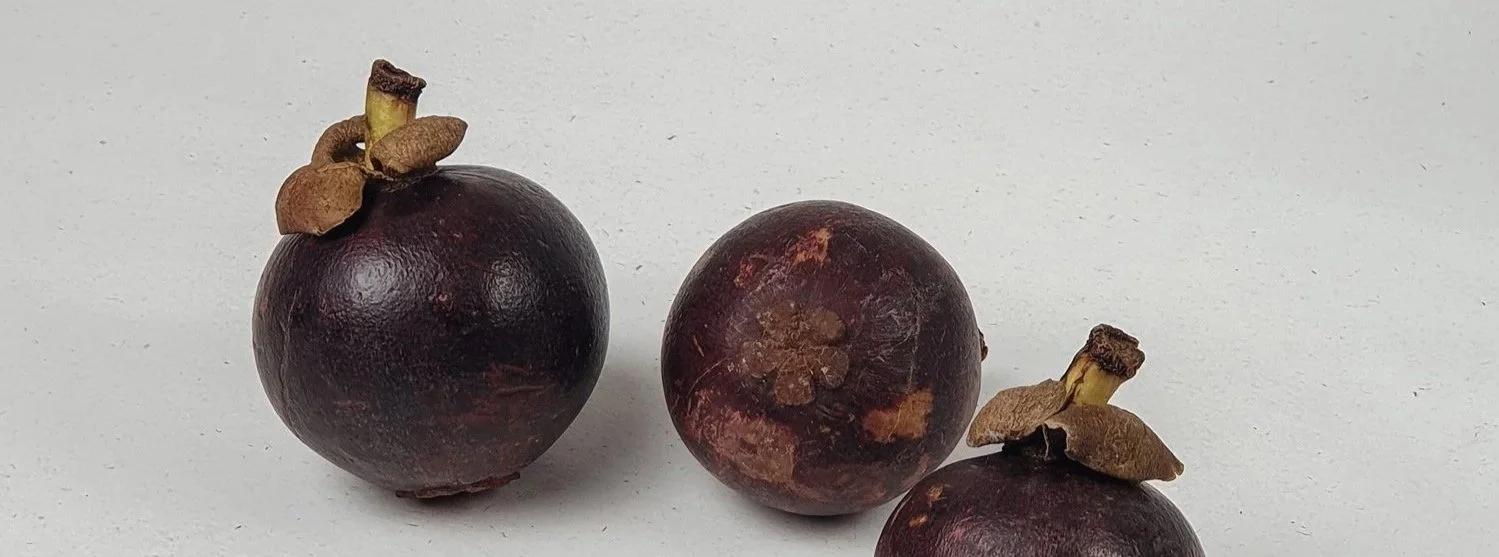 Minimalist, natural still life aesthetic of mangosteen fruits
