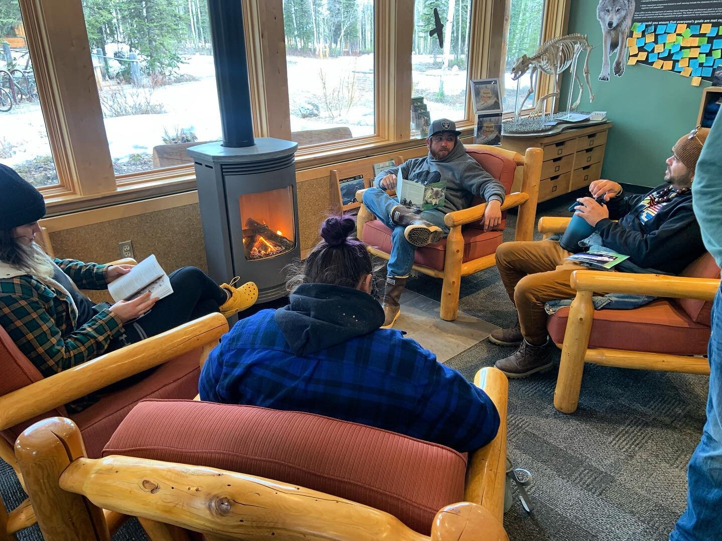 We got the crew into the park today to start beefing up on their Denali info. They found a warm spot by the fire to sit and learn a little before our end of day presentations.