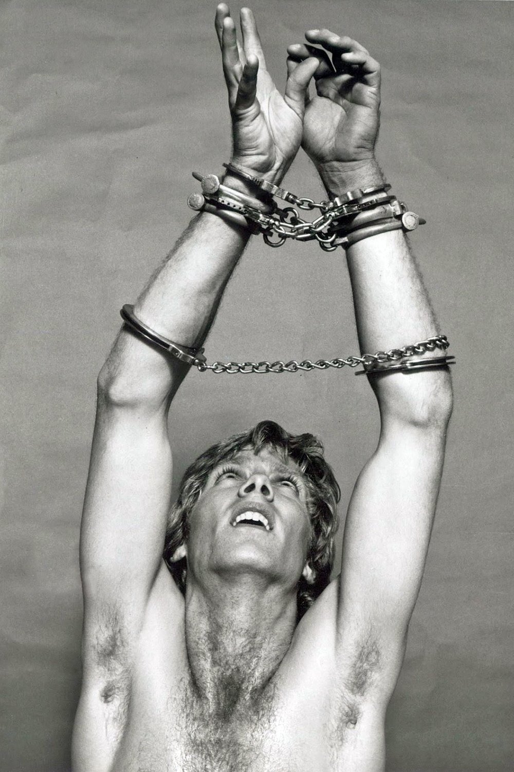 1982 handcuffs hairy chest.jpg