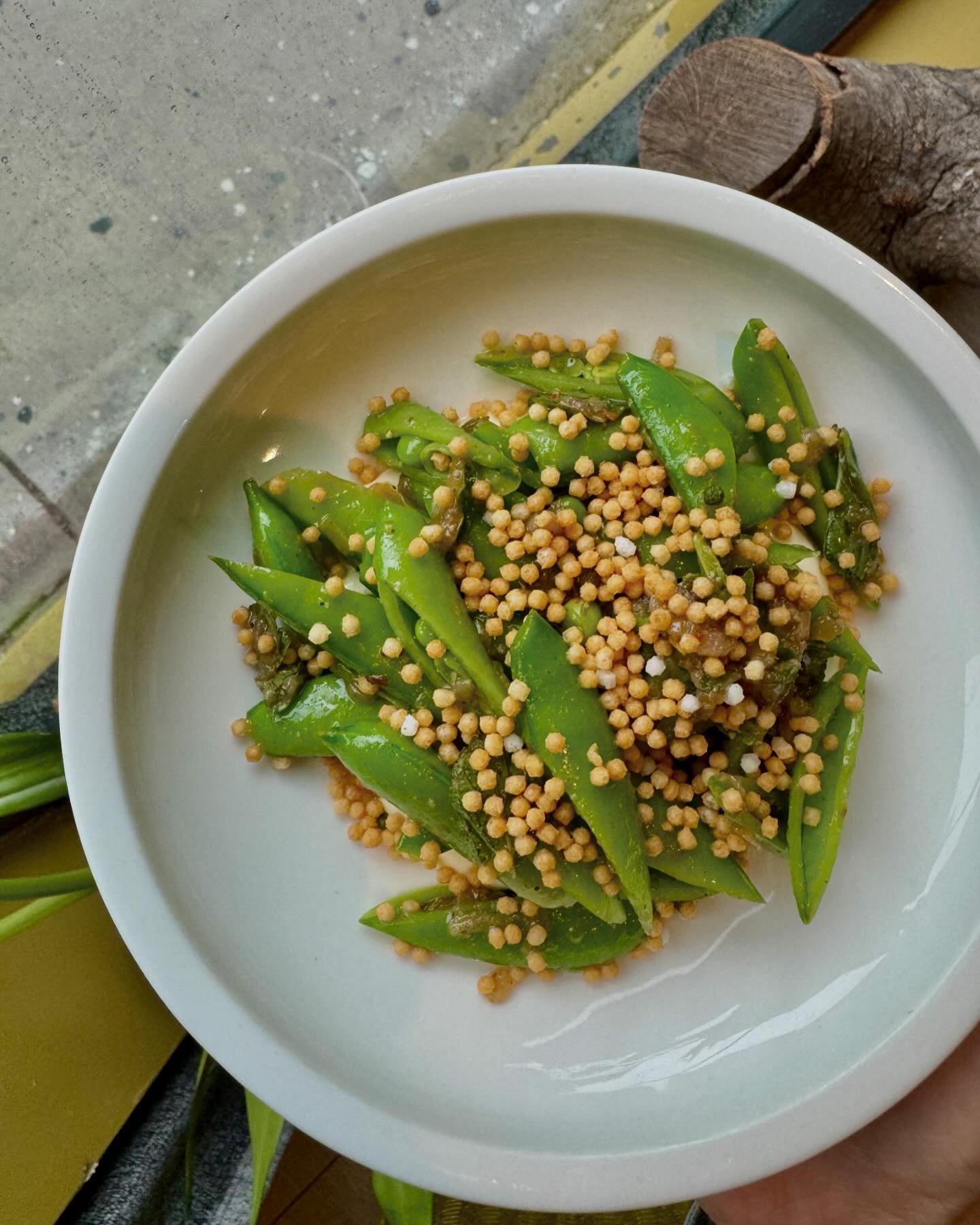 sunny, with a chance of abundant snap peas tonight 🫛🫛 green garlic, moroccan mint, ricotta, bubu arare! #HLAYforever