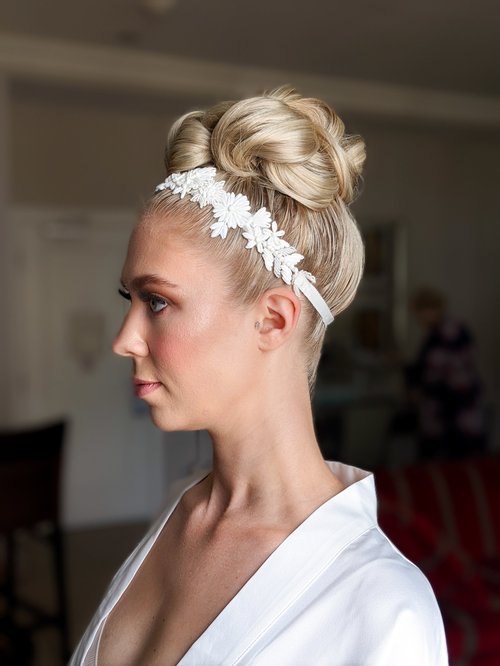 Headband tuck curly updo for wedding