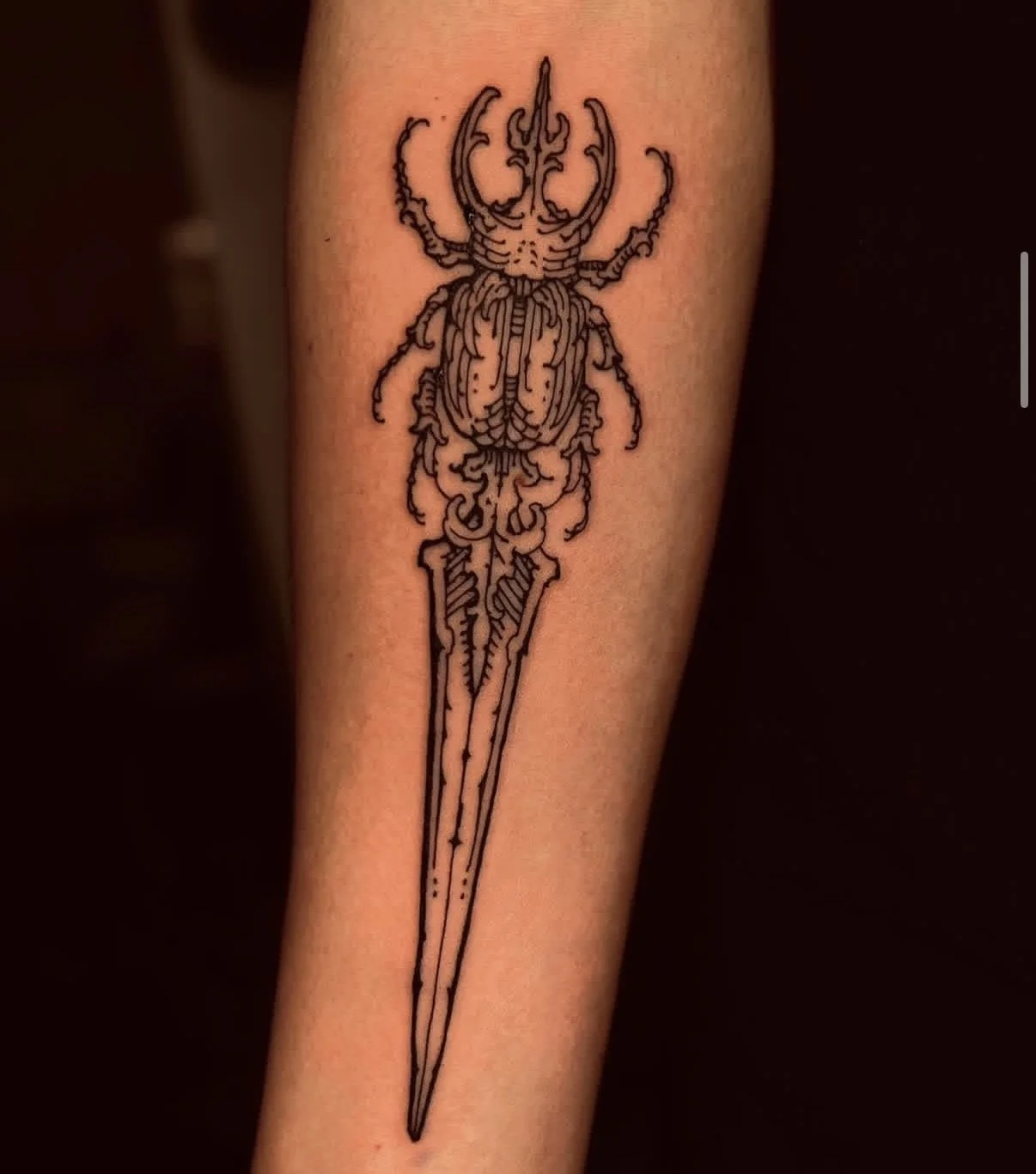 Beetle dagger tattoo