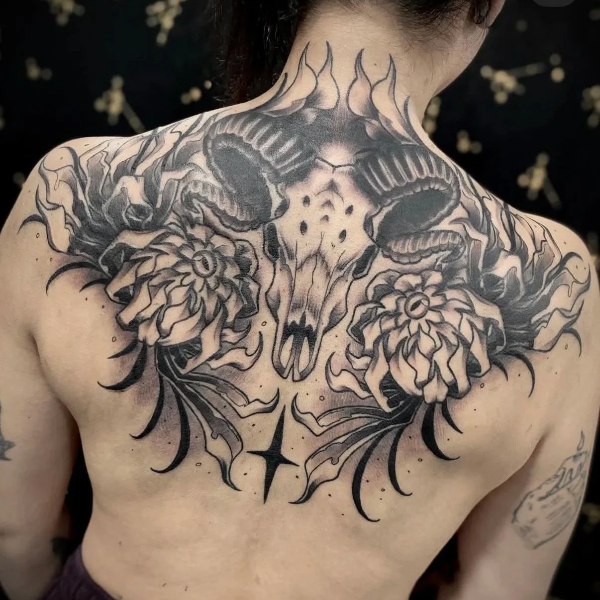 Ram back piece done by @midknight.ink
