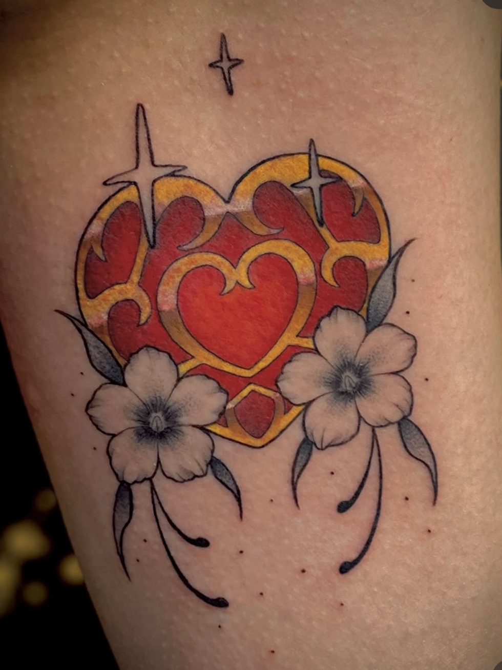 heart tattoo done by @midknight.ink