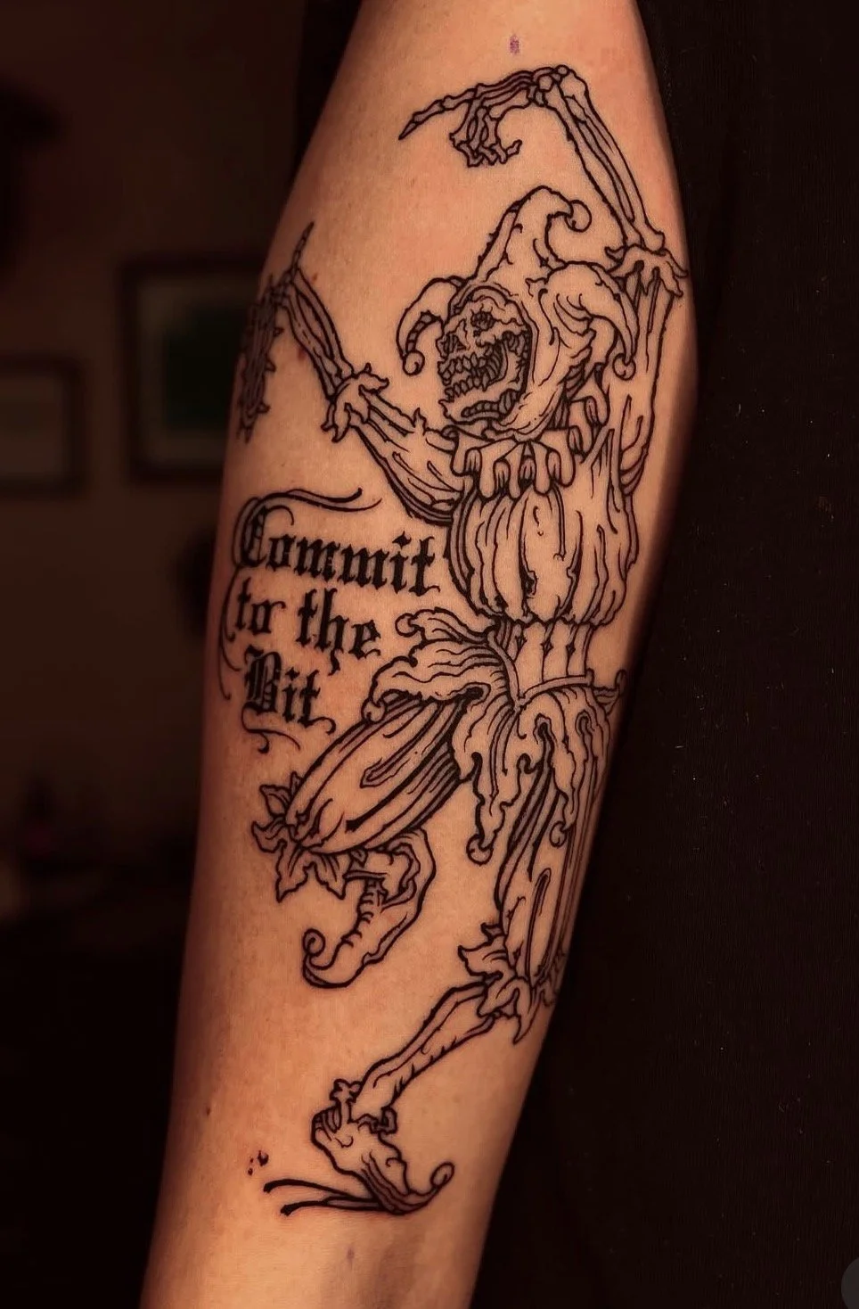 Skull face jouster tattoo