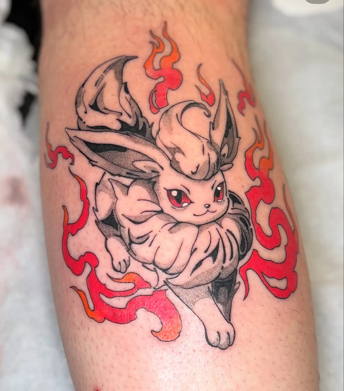flareon tattoo design done by @just_mem_tattoo in Calgary