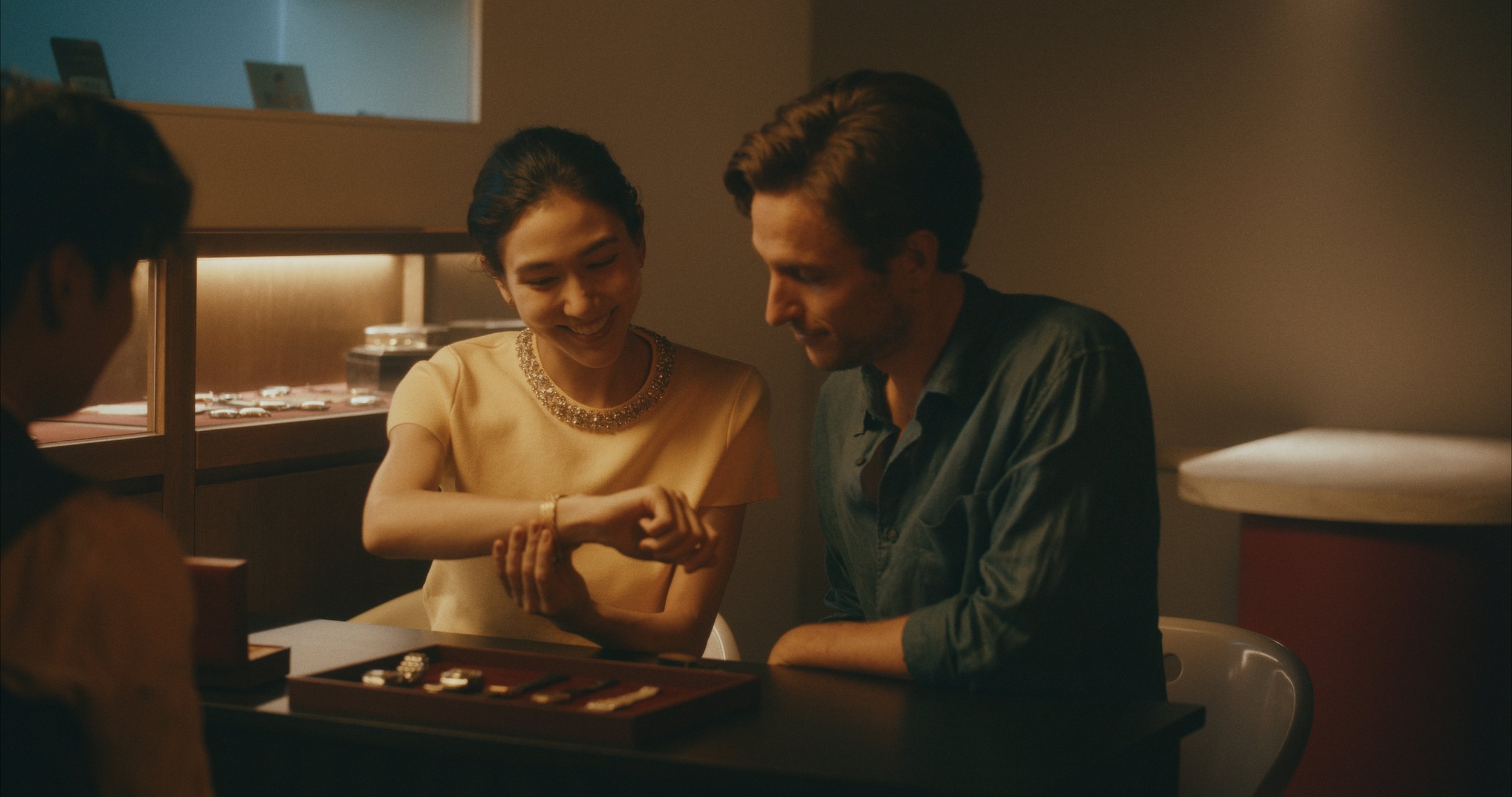 A couple shopping at an antinque watch shop