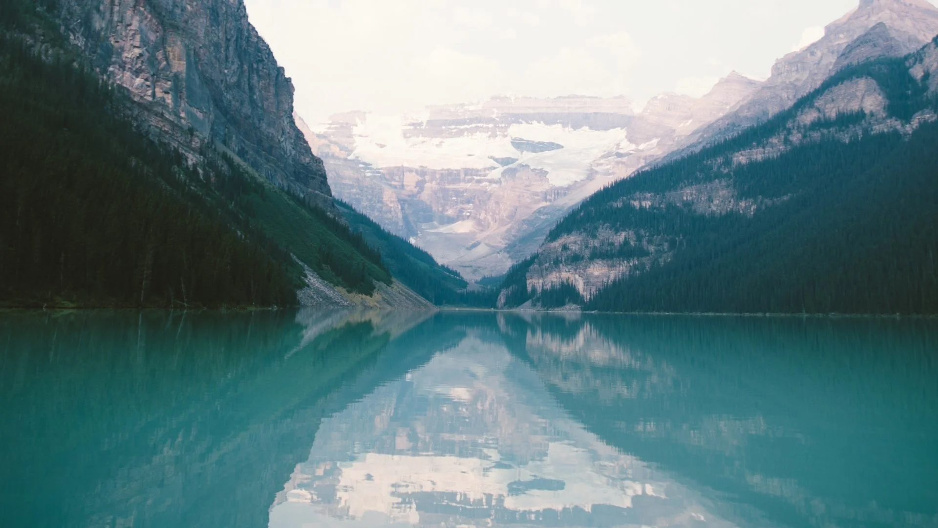 Mountain landscape with turquoise lake reflection