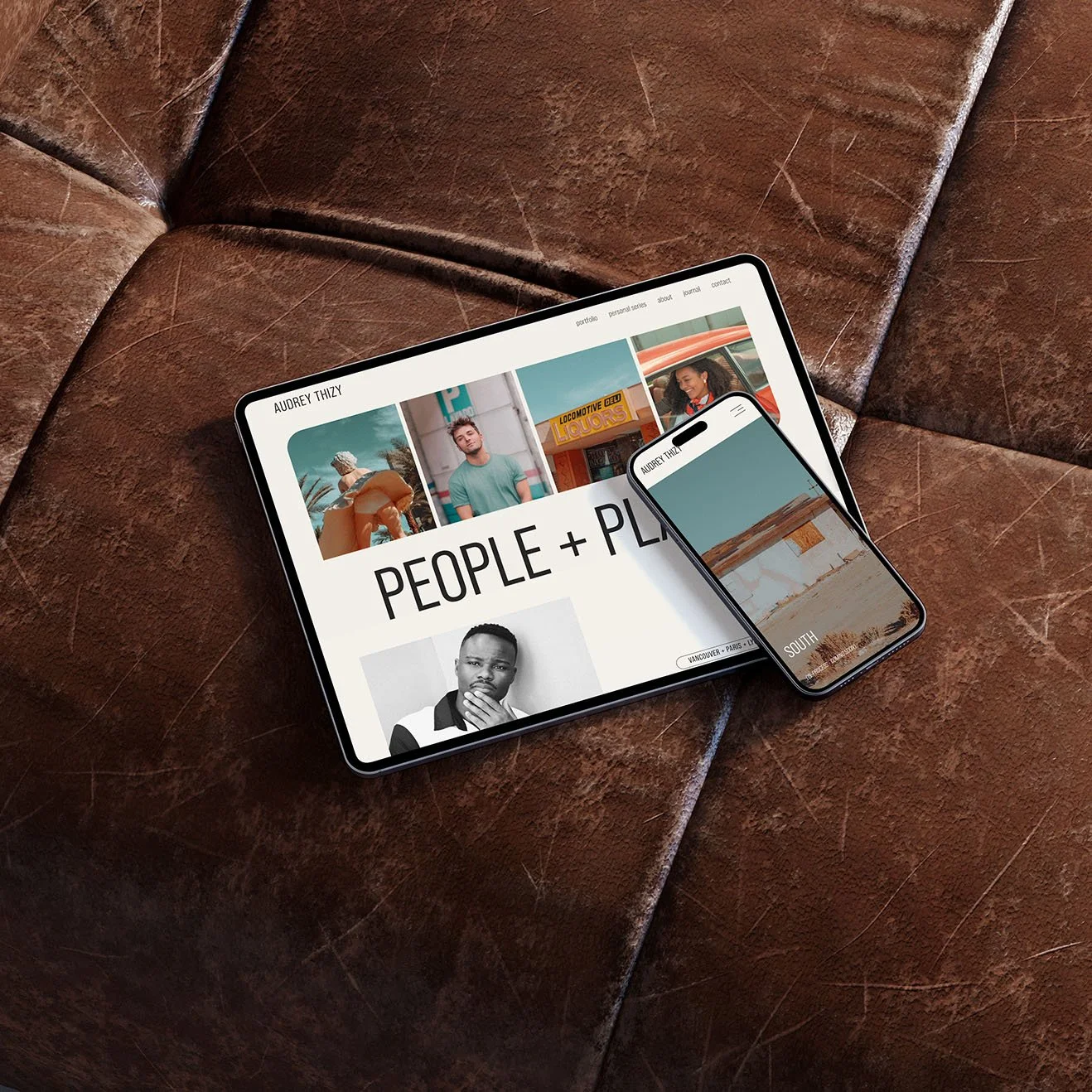 Tablet and smartphone on brown leather couch displaying a squarespace website design for a photographer