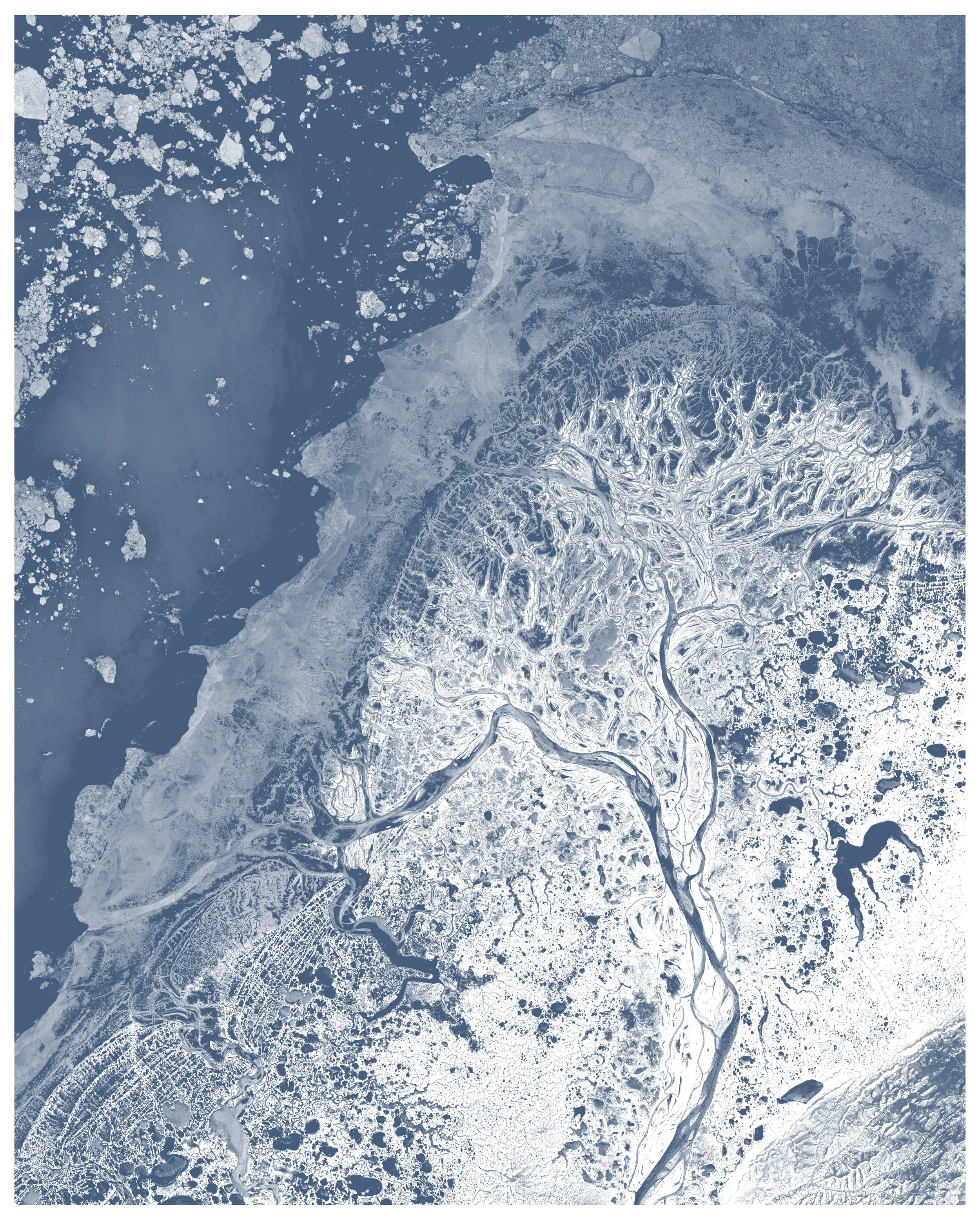 The frozen Yukon Delta, covered in snow with only a handful human settlements across its 130,000 km2  – Landsat 8 satellite composite.
Blue shows water, white shows snow and ice