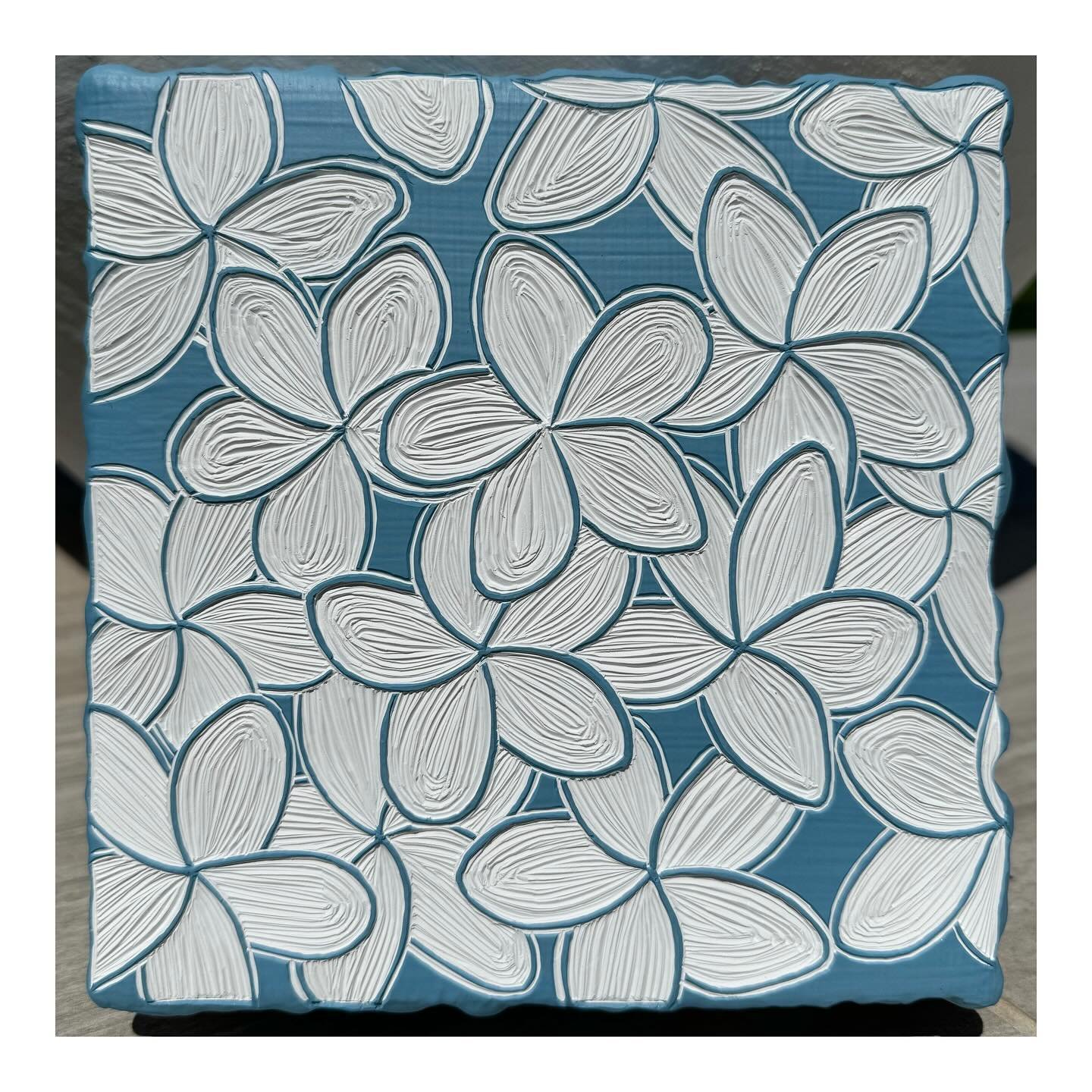 &lsquo;White Frangipani on Pisces Blue&rsquo; 🌀🌸

Acrylic paint carving 
35 layers on salvaged cypress wood
16.5cm x 16.5cm x 3.5cm 

Swipe for video and close up. 

#paintcarving 
#anitakalaitzakisart