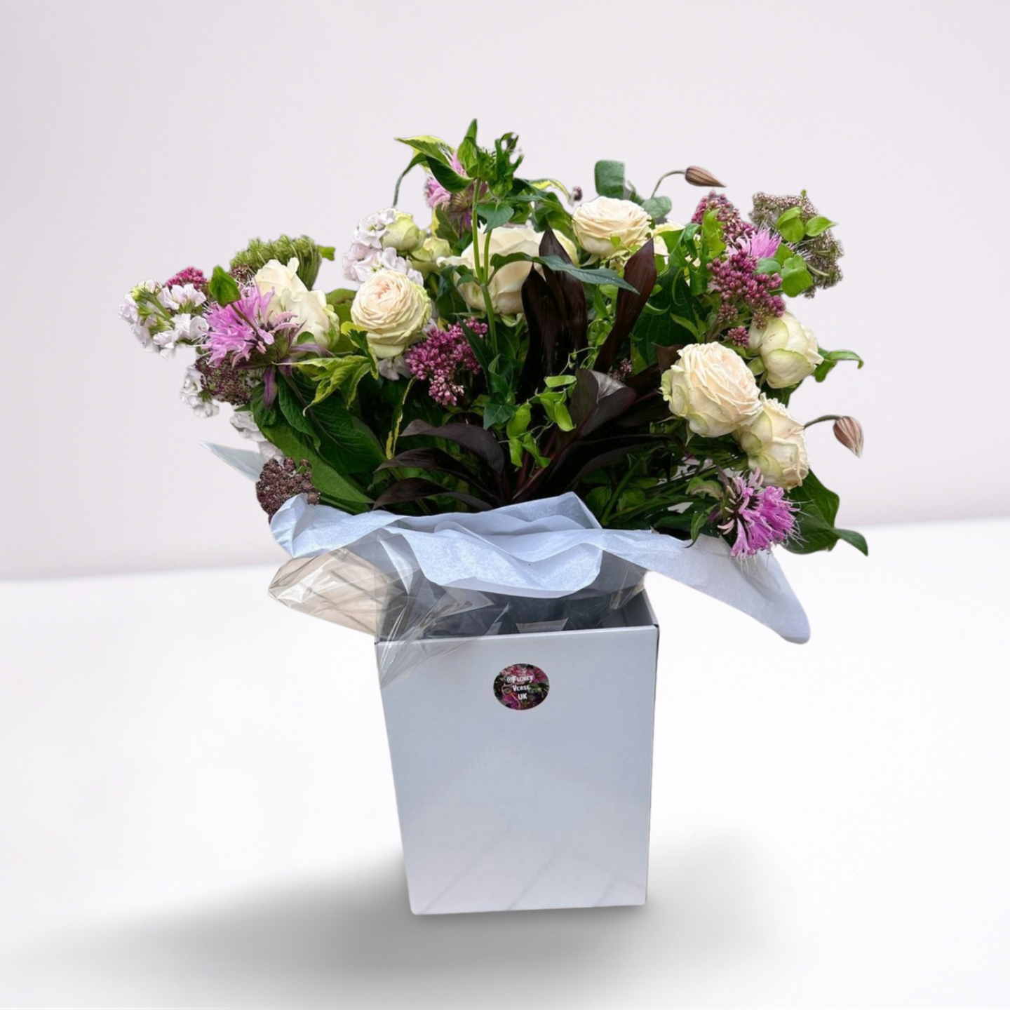 The Westminster College bouquet full of purple, white, pink flowers presented in a luxury box The Westminster bouquet of flowers by Flowerverse of Cambridge