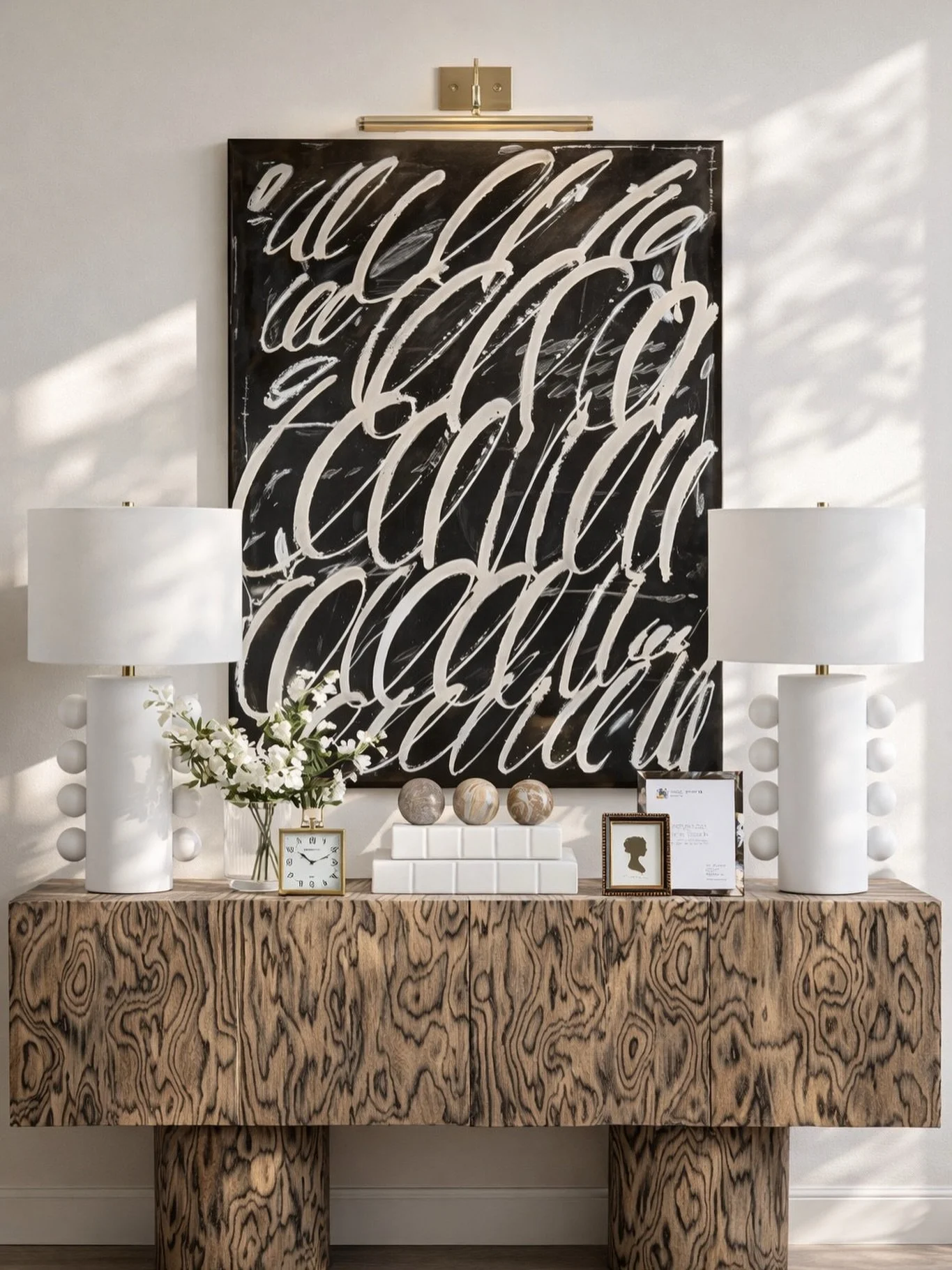 This is how you make an entryway feel instantly elevated. 🤍
Balanced, symmetrical, and anchored with statement art + sculptural lighting&mdash;every piece here works together to create a polished first impression. 

Comment SHOP below to receive a D